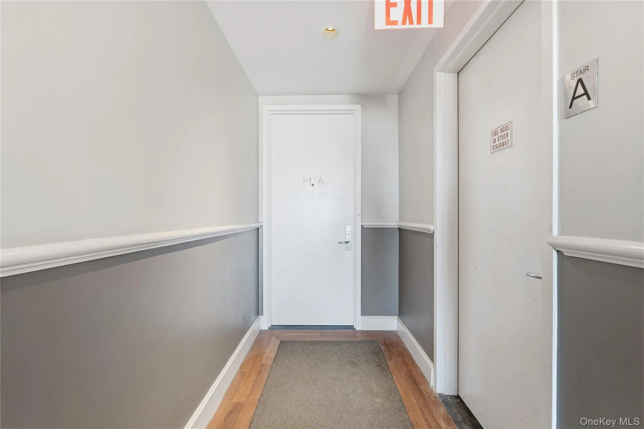 Entryway featuring wood finished floors and baseboards Entryway featuring wood finished floors and baseboards