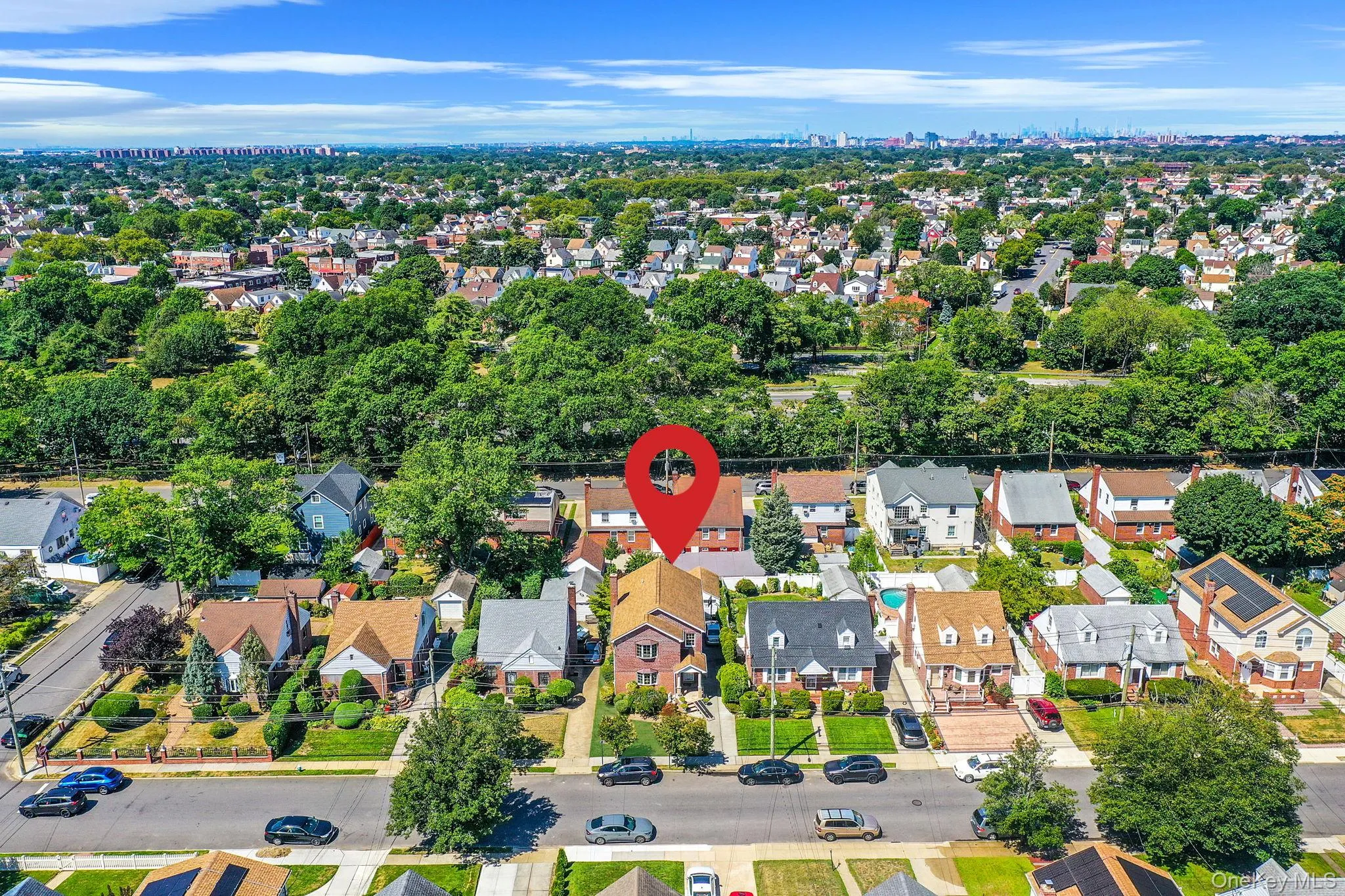 Aerial view of property and surrounding area featuring nearby suburban area Aerial view of property and surrounding area featuring nearby suburban area