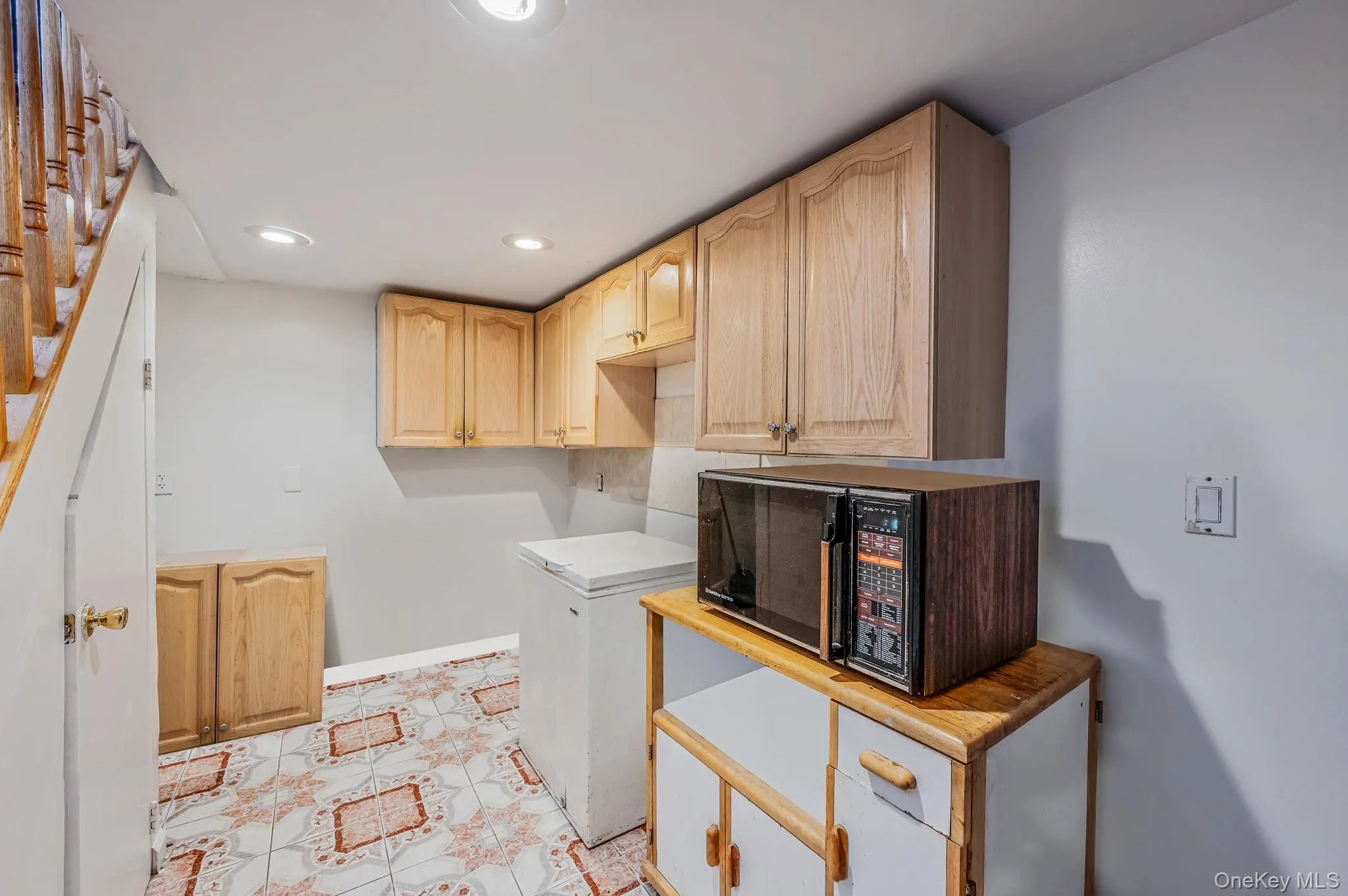 Laundry area with recessed lighting and baseboards Laundry area with recessed lighting and baseboards