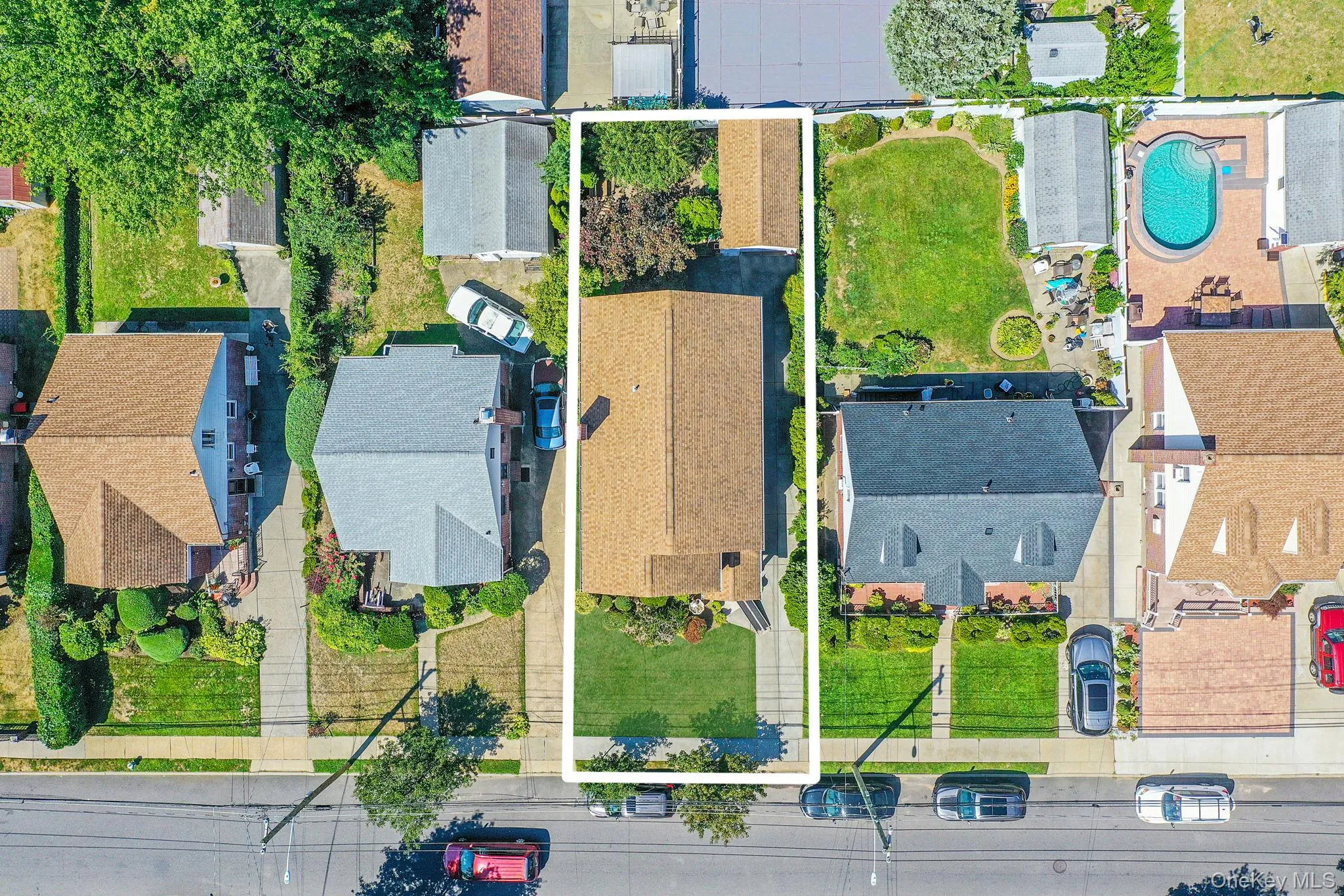 Aerial perspective of suburban area with property boundaries highlighted Aerial perspective of suburban area with property boundaries highlighted
