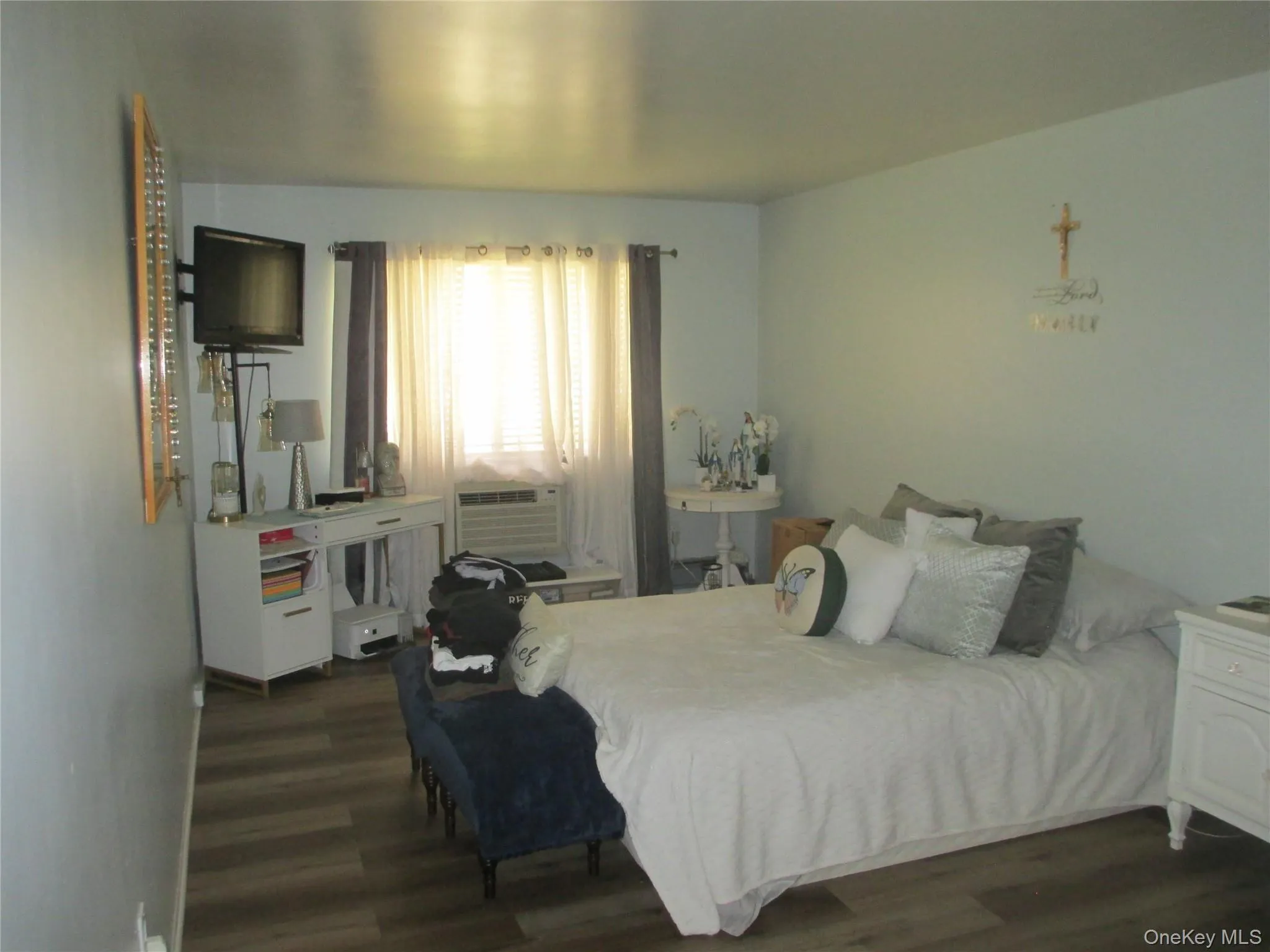 Bedroom featuring dark wood-type flooring and cooling unit Bedroom featuring dark wood-type flooring and cooling unit
