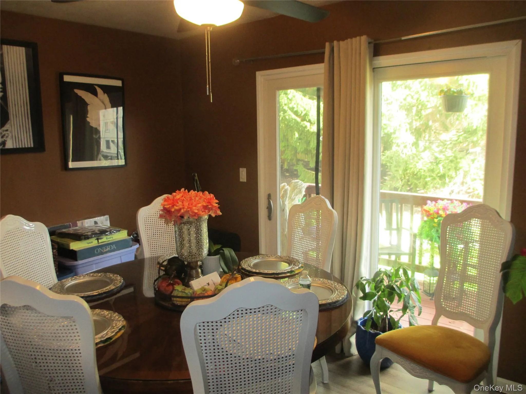 Dining area featuring ceiling fan and wood finished floors Dining area featuring ceiling fan and wood finished floors