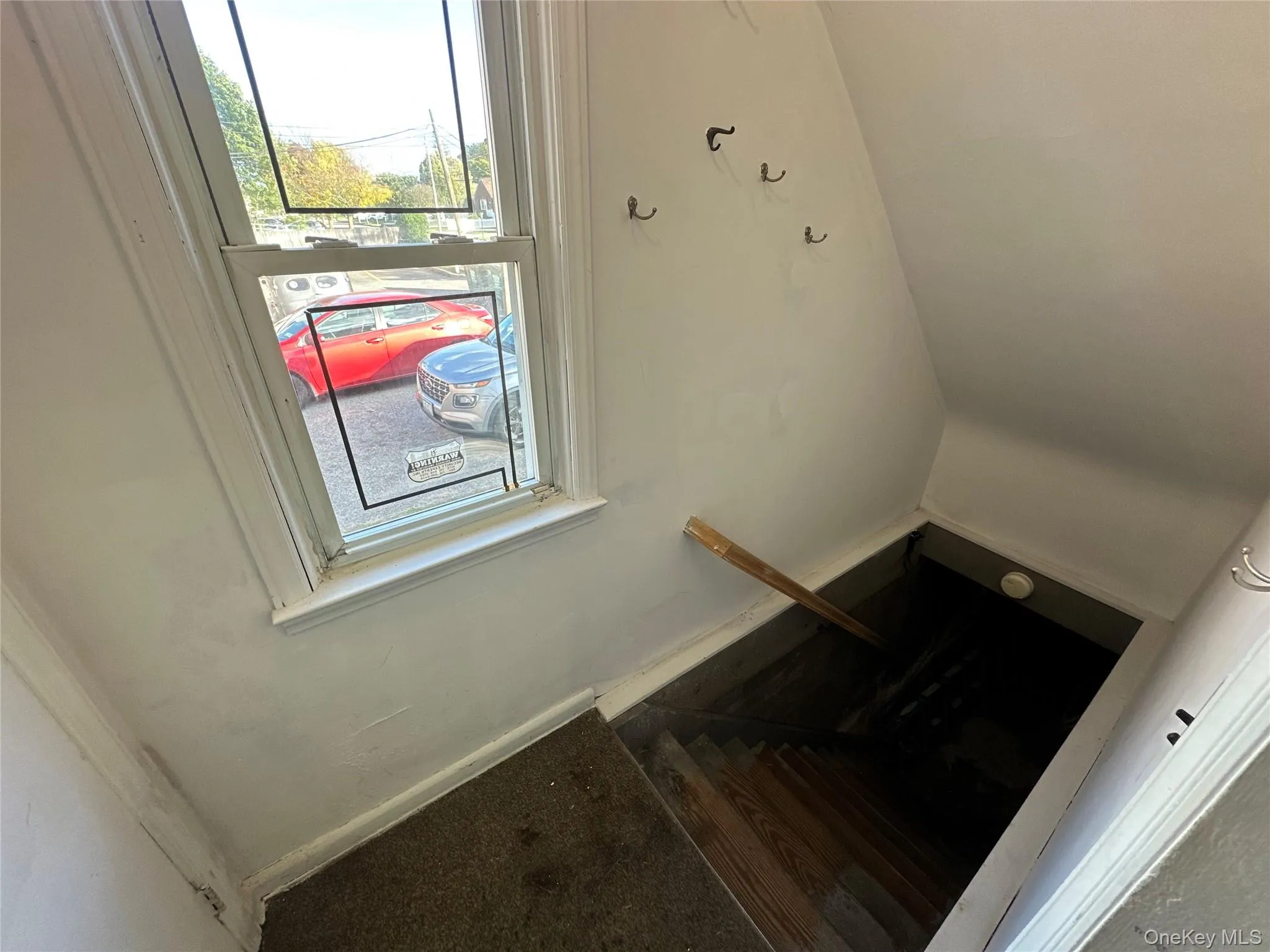 Staircase featuring baseboards Staircase featuring baseboards