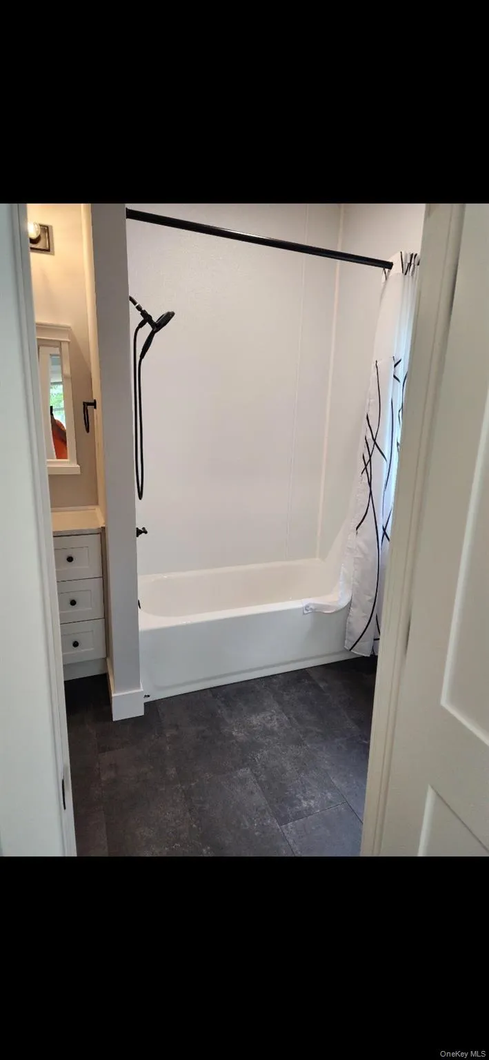 Full bath with shower / bath combo with shower curtain and vanity Full bath with shower / bath combo with shower curtain and vanity