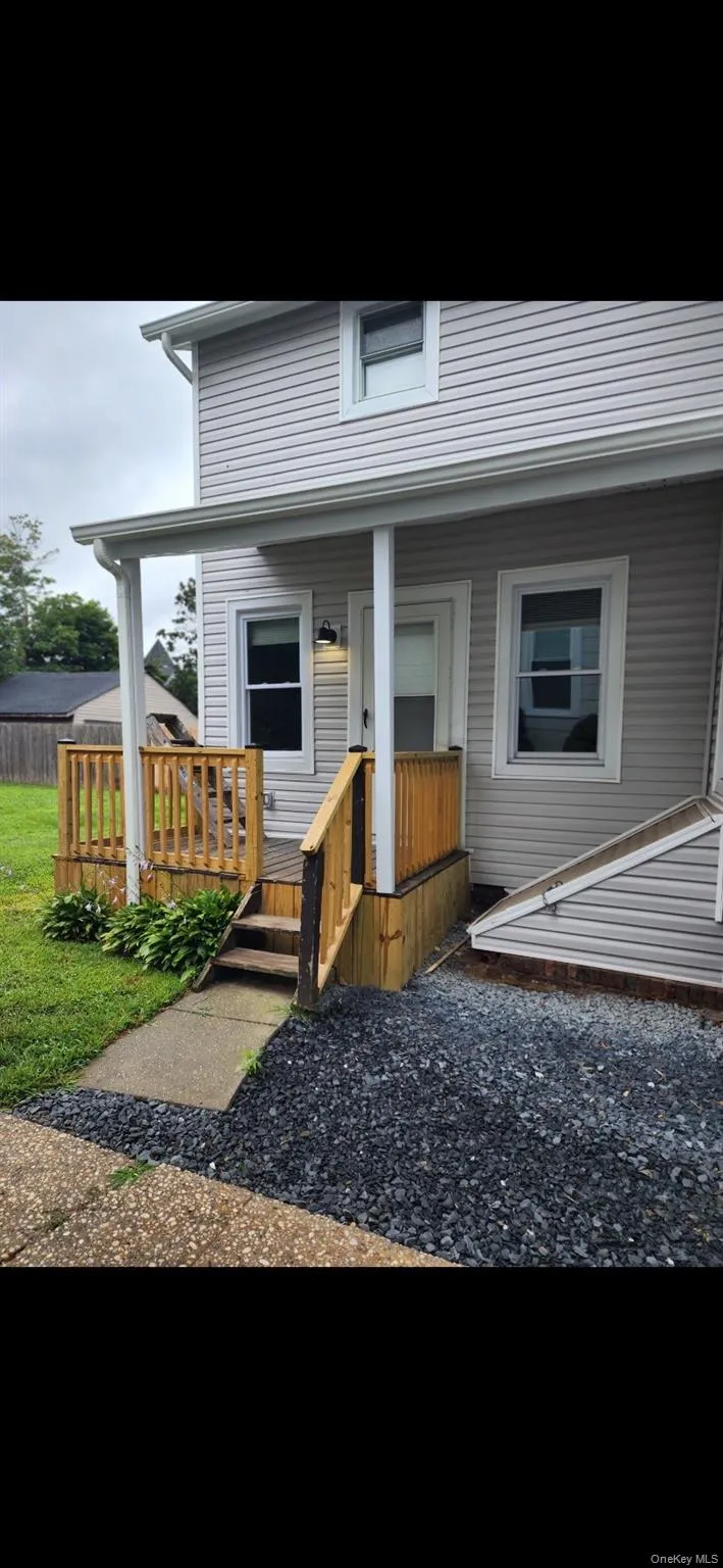 Rear view of house with a porch Rear view of house with a porch