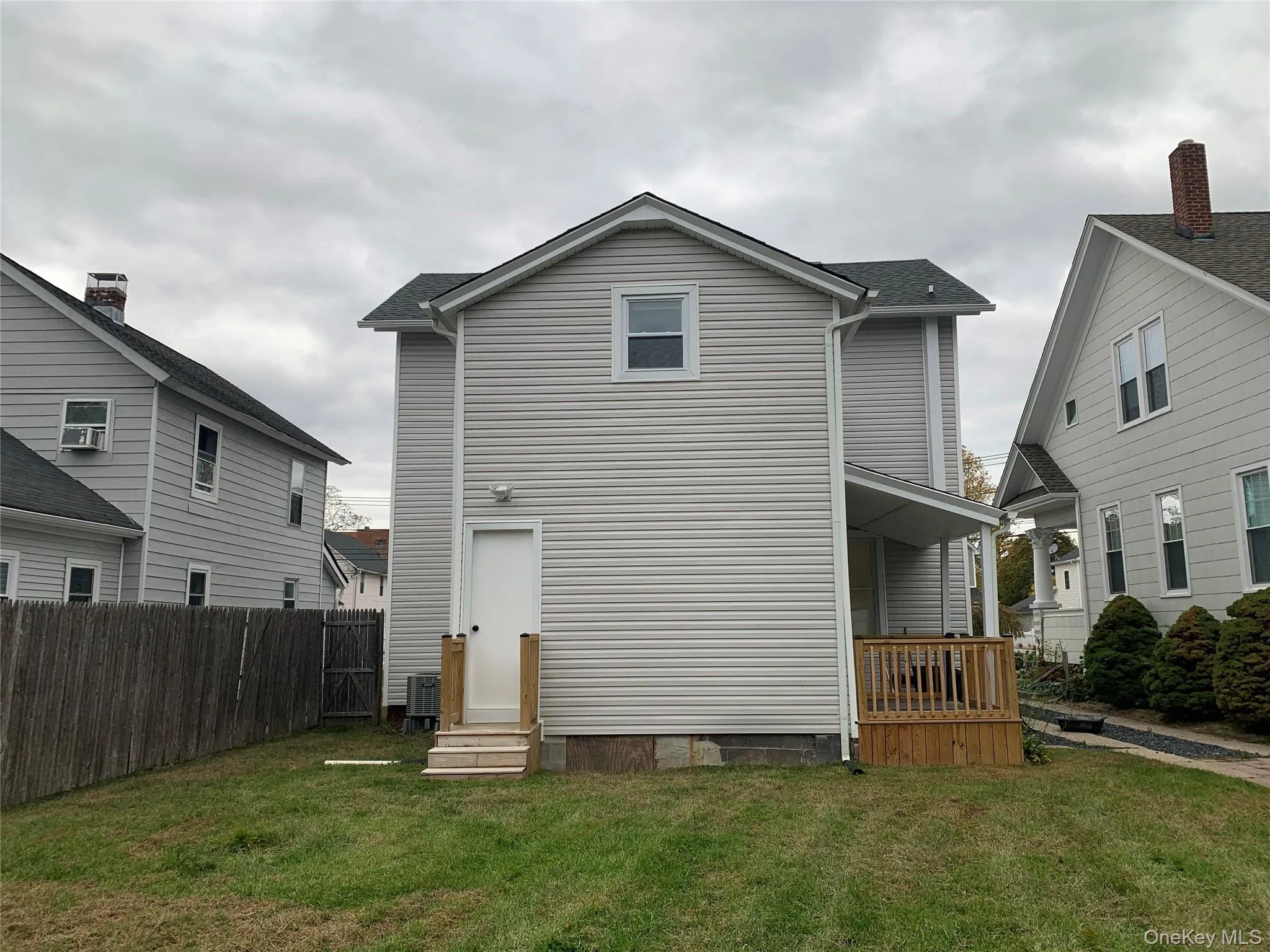Rear view of house featuring entry steps and crawl space Rear view of house featuring entry steps and crawl space