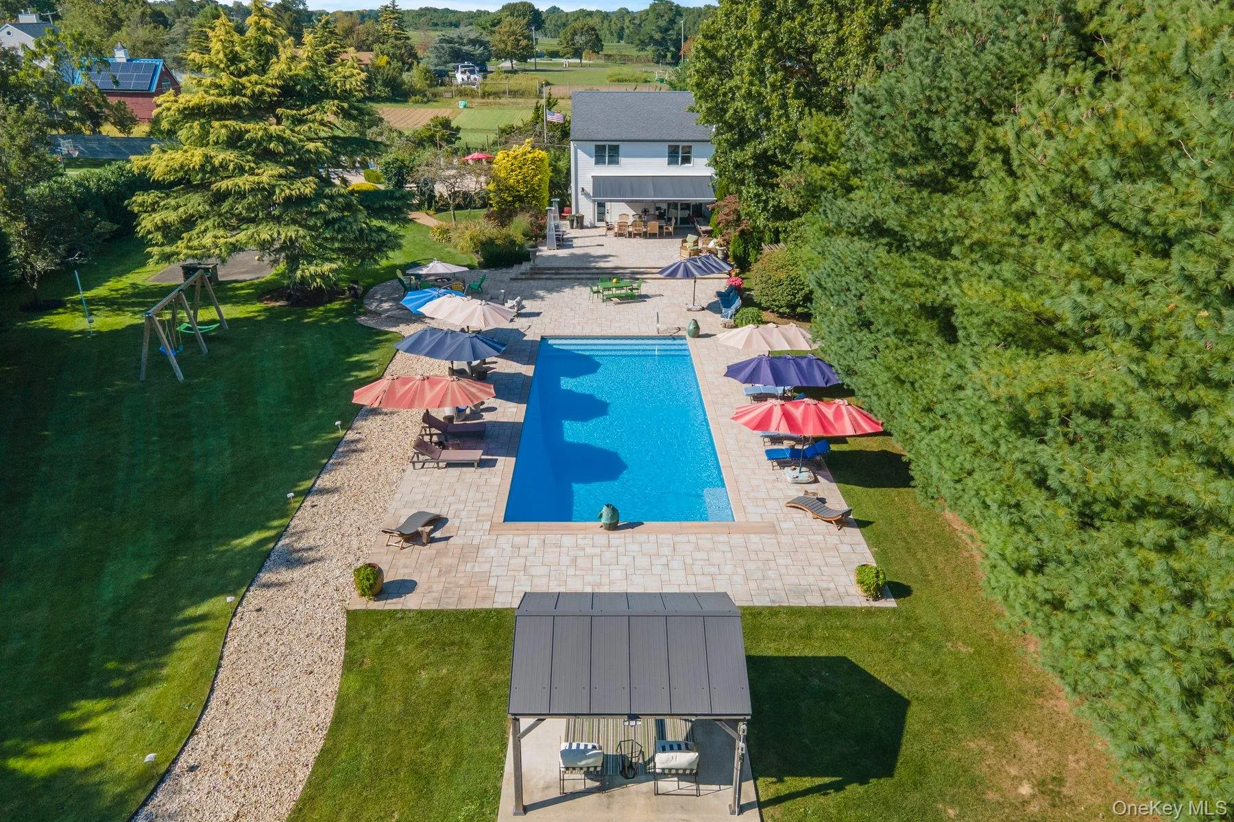 View of subject property with a pool area View of subject property with a pool area