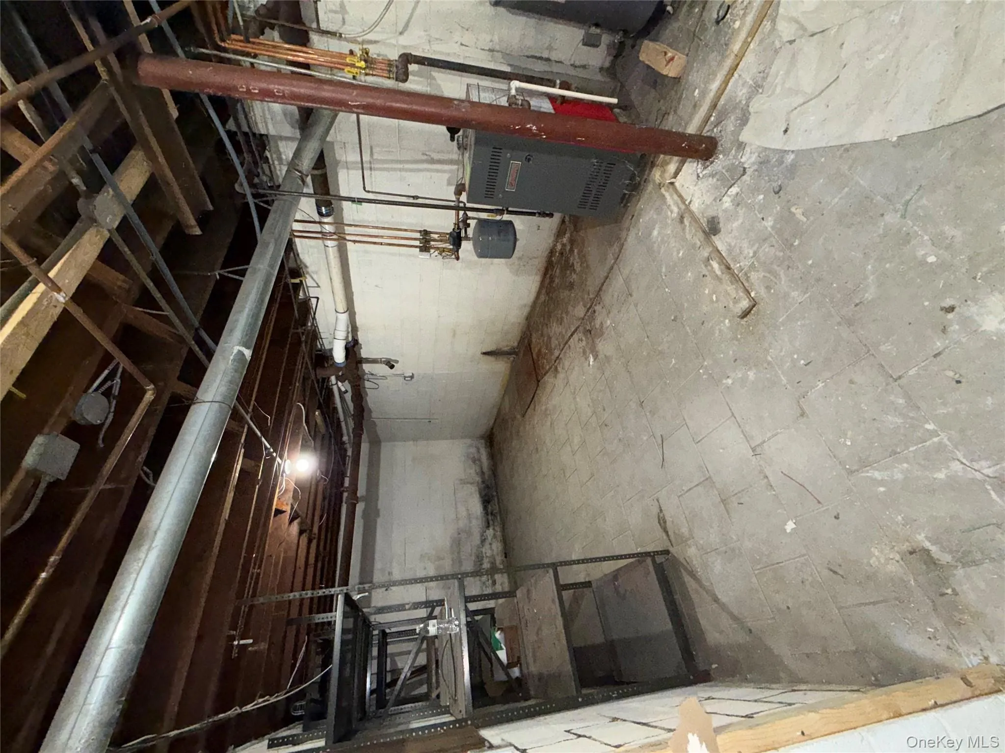 Unfinished below grade area with a heating unit Unfinished below grade area with a heating unit