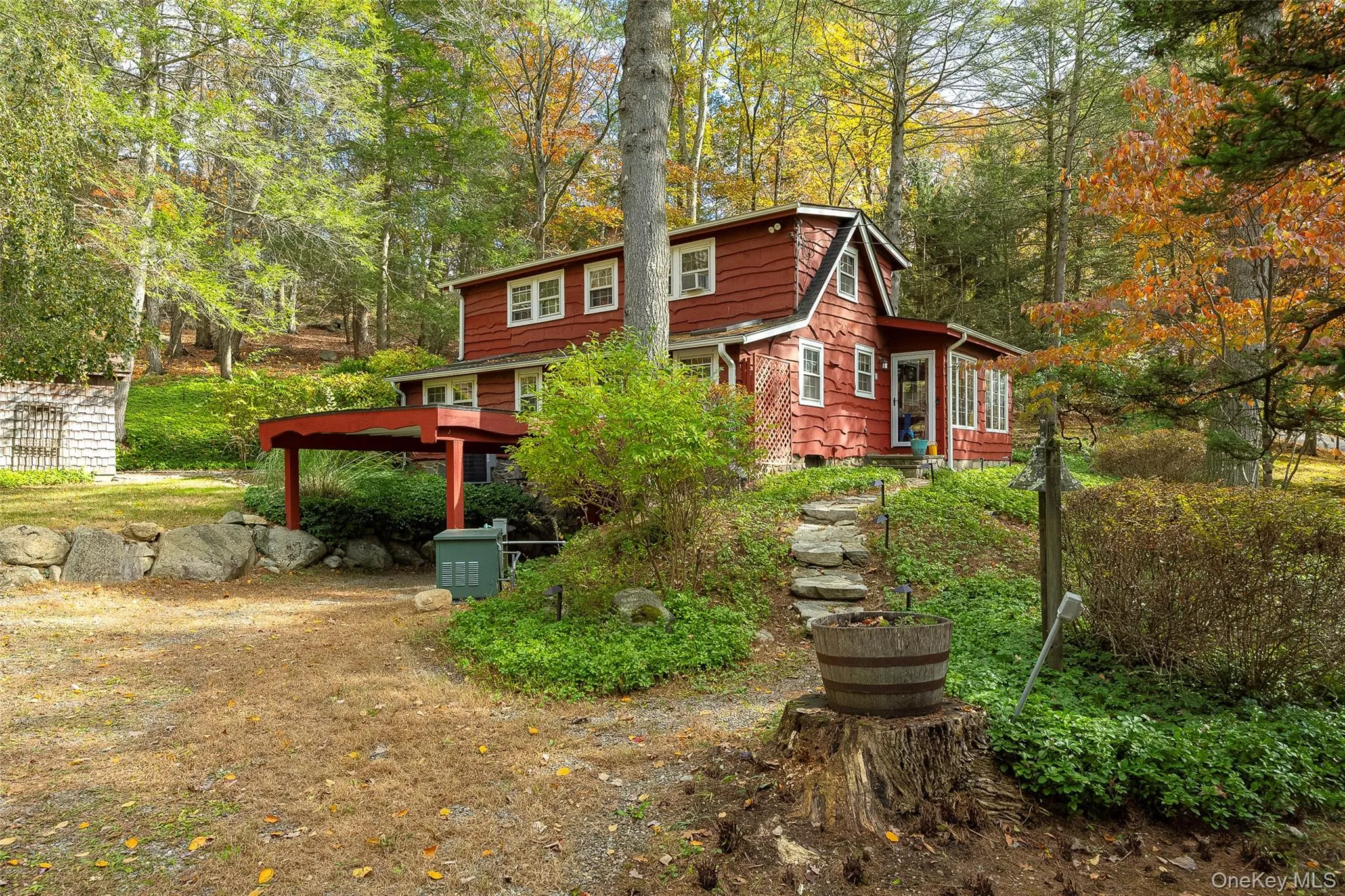 Back of house with a wooded view Back of house with a wooded view