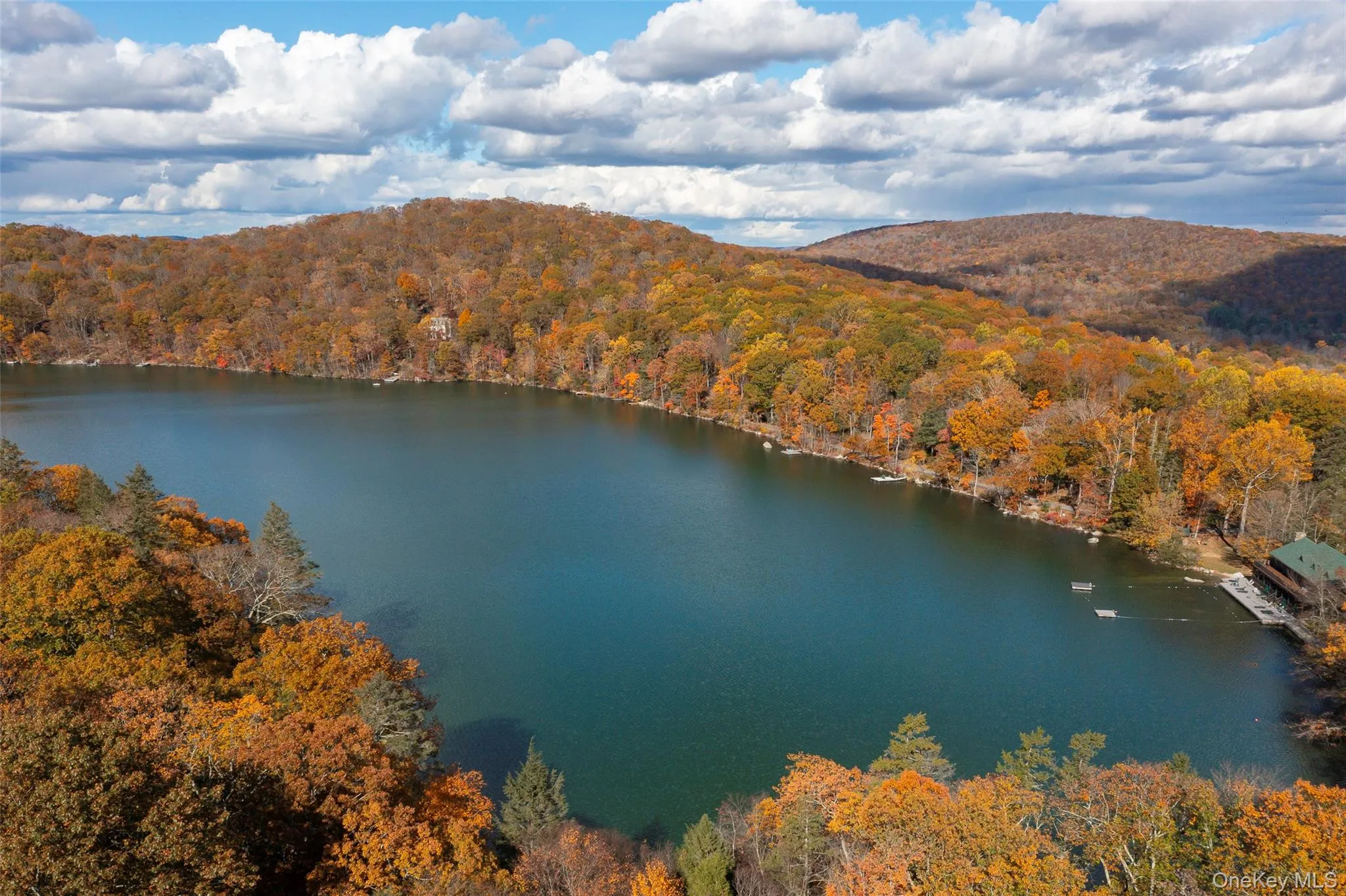 Drone / aerial view of a water and mountain view Drone / aerial view of a water and mountain view