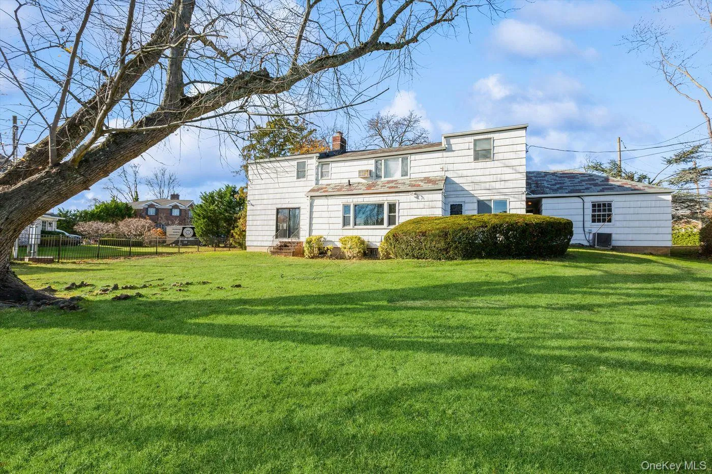 Rear view of property with a chimney Rear view of property with a chimney