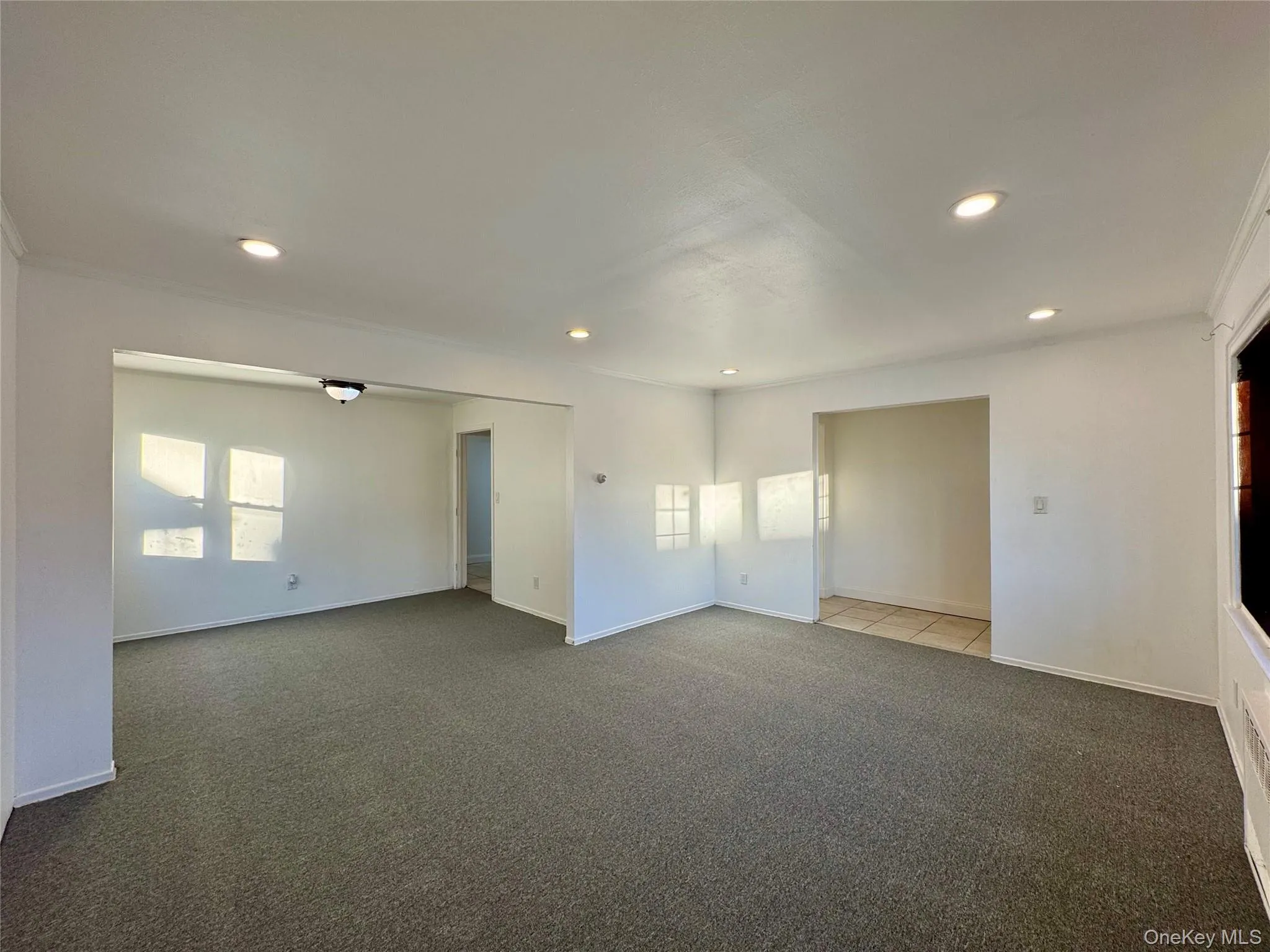 Spare room featuring carpet flooring and recessed lighting Spare room featuring carpet flooring and recessed lighting