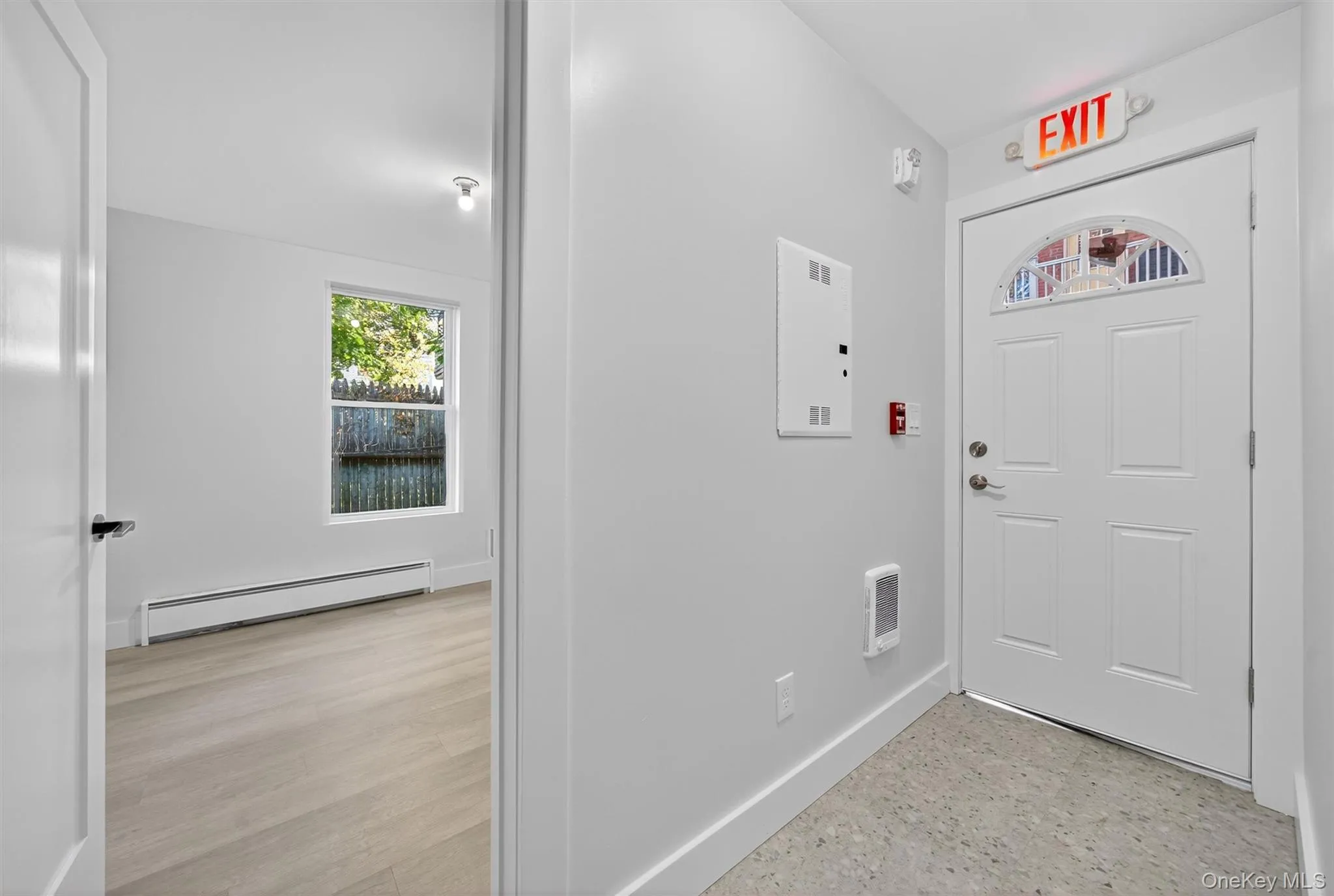 Foyer entrance with baseboards and a baseboard radiator Foyer entrance with baseboards and a baseboard radiator