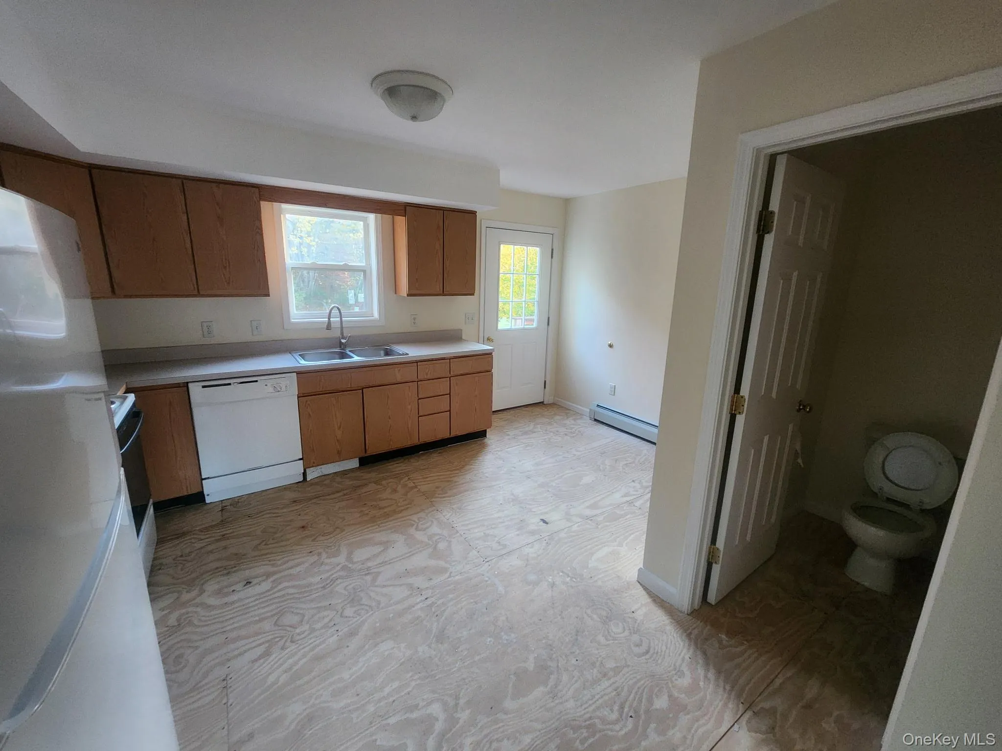 Kitchen featuring access to community back yard. Kitchen featuring access to community back yard.