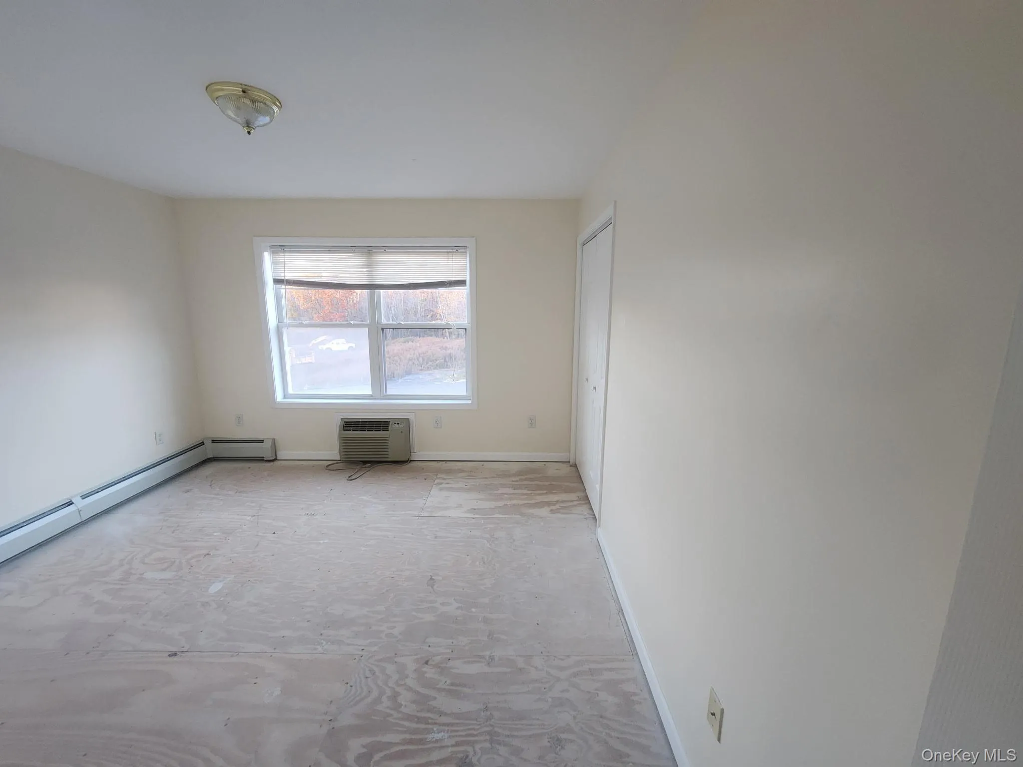 Unfurnished room featuring baseboards and large closets. Unfurnished room featuring baseboards and large closets.