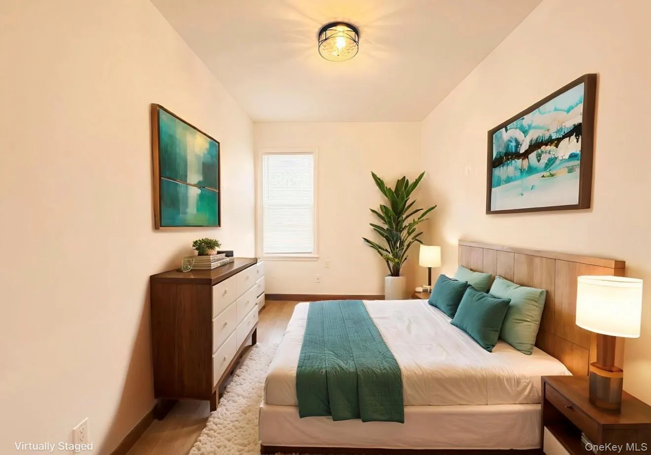 Bedroom with baseboards and wood finished floors Bedroom with baseboards and wood finished floors