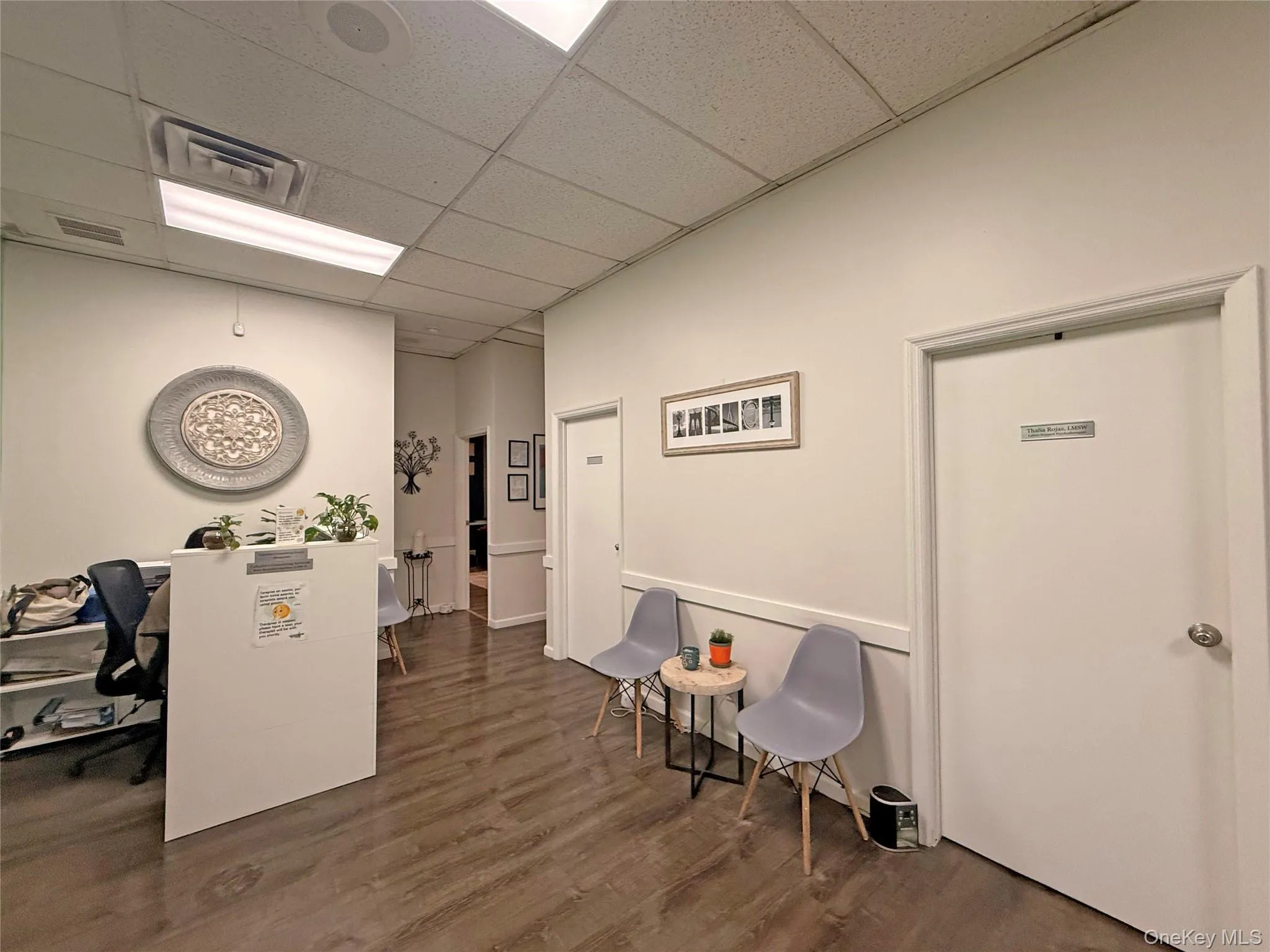 Office space featuring a drop ceiling Office space featuring a drop ceiling