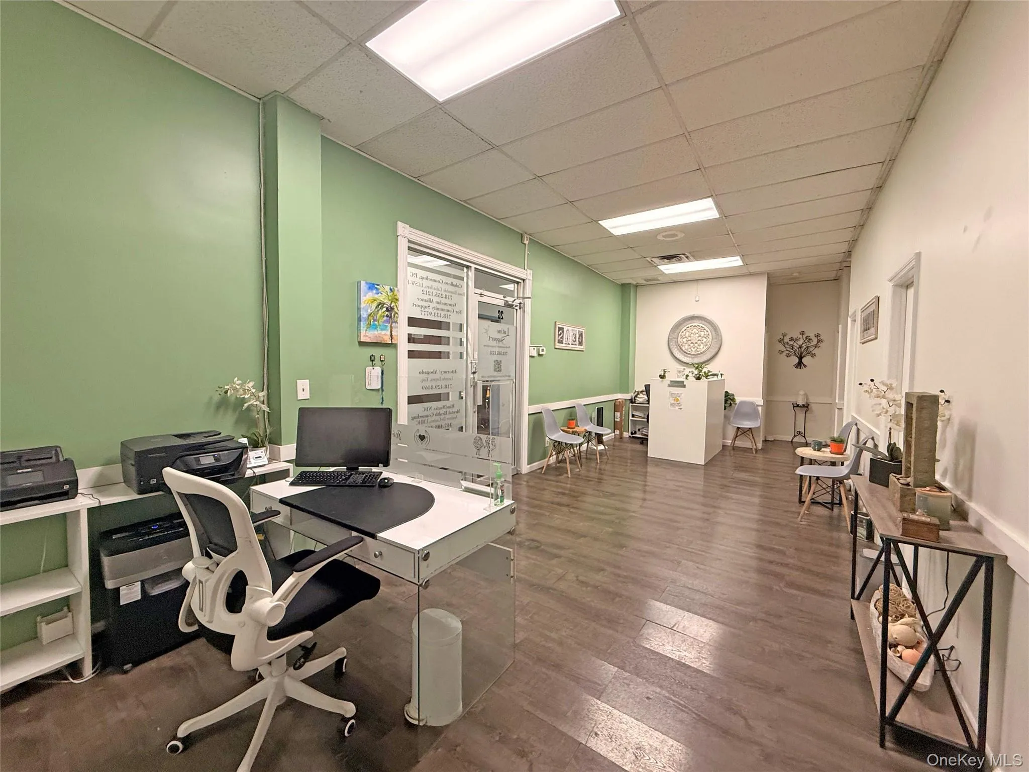 Office with a paneled ceiling Office with a paneled ceiling