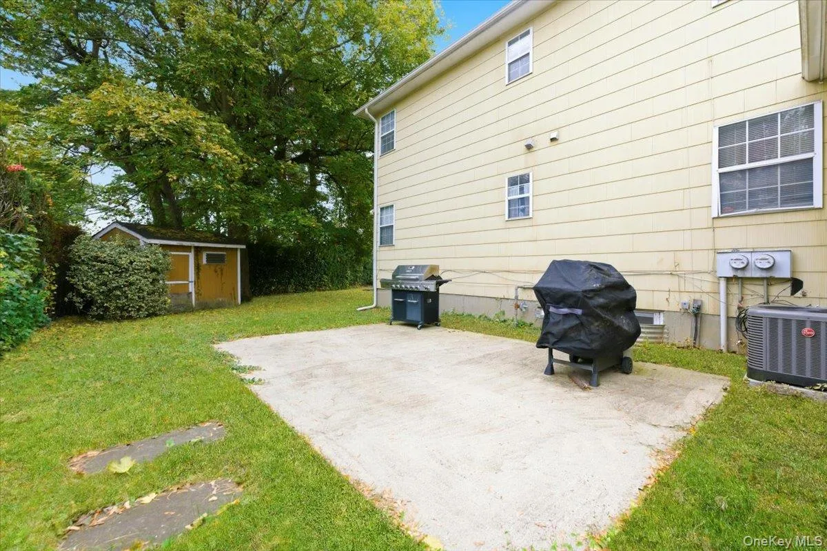 View of patio / terrace with grilling area and a storage shed View of patio / terrace with grilling area and a storage shed