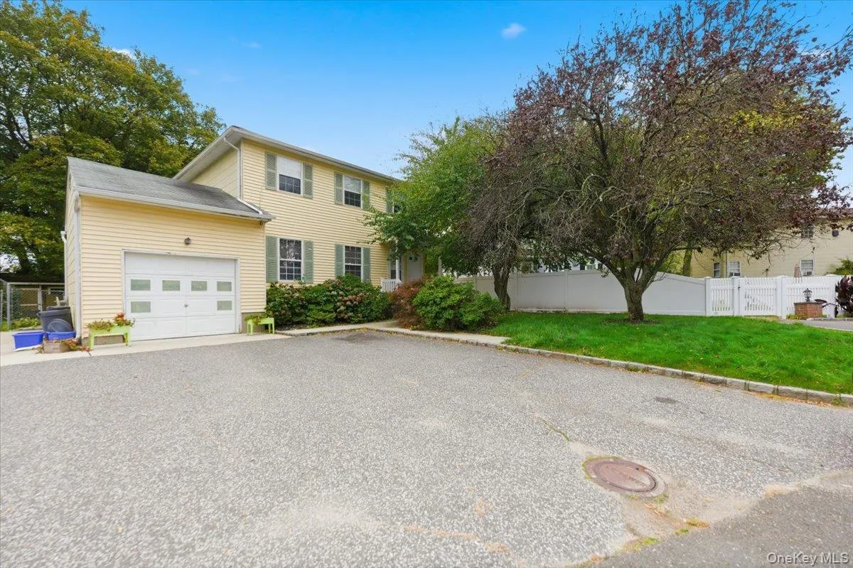 View of front of house featuring an attached garage and driveway View of front of house featuring an attached garage and driveway