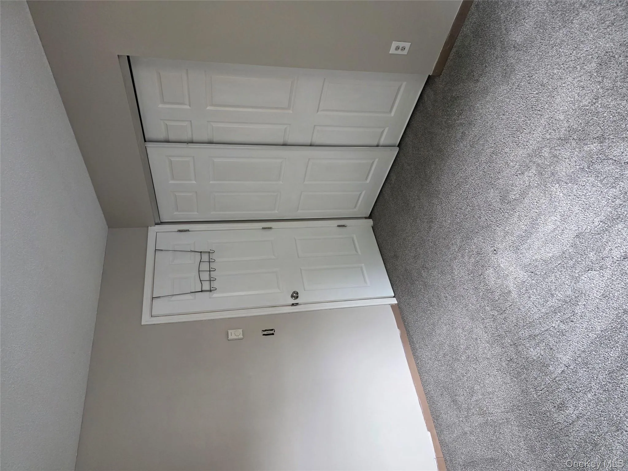 Unfurnished bedroom featuring a closet, carpet, and a textured ceiling Unfurnished bedroom featuring a closet, carpet, and a textured ceiling