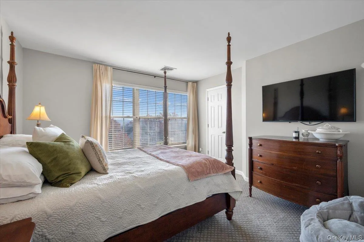 Carpeted bedroom featuring baseboards Carpeted bedroom featuring baseboards
