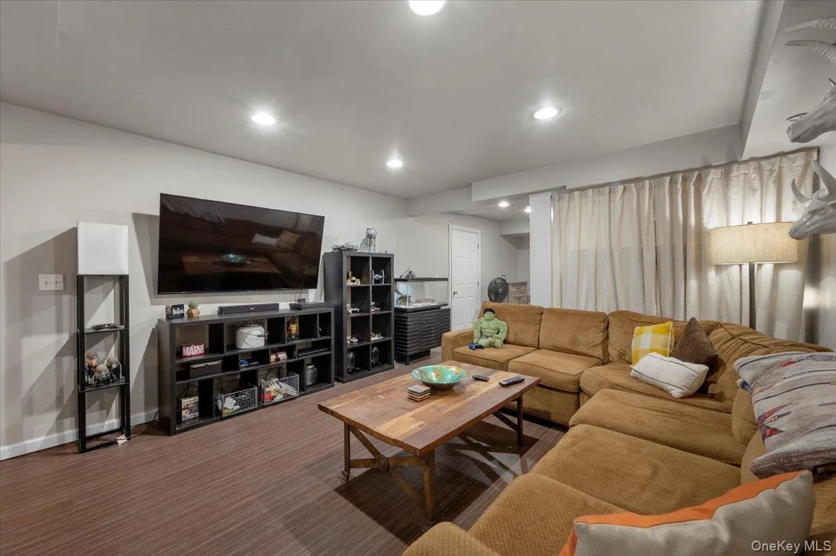 Living area with recessed lighting and carpet floors Living area with recessed lighting and carpet floors