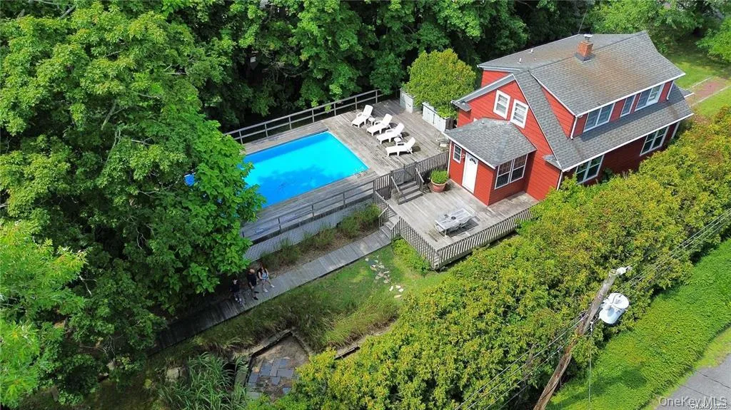View from above of property featuring a pool area View from above of property featuring a pool area