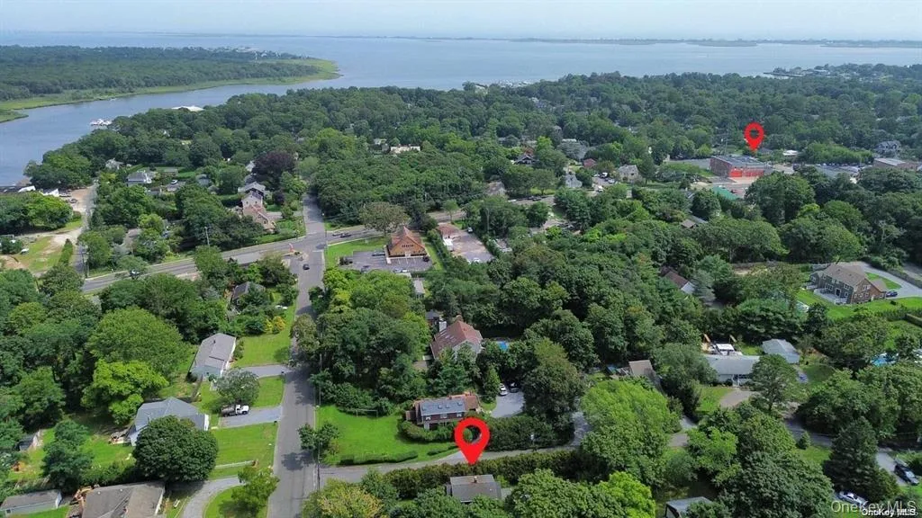 Aerial view of a heavily wooded area and a large body of water Aerial view of a heavily wooded area and a large body of water