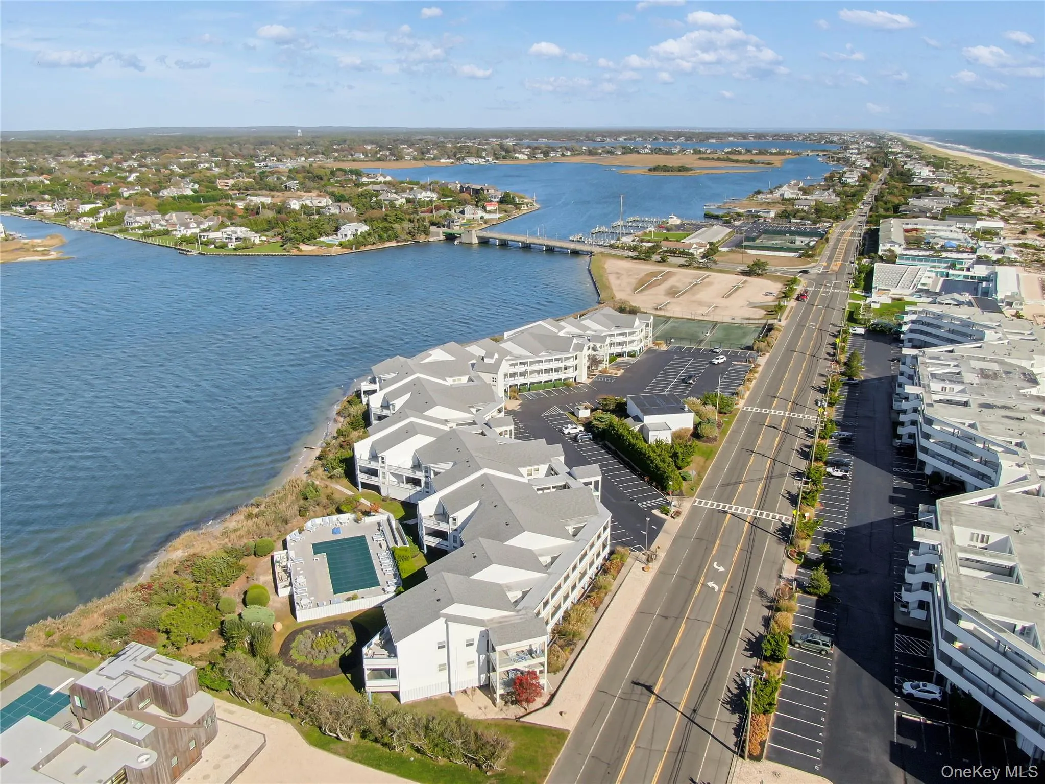 Aerial view of a notable bridge and a large body of water Aerial view of a notable bridge and a large body of water