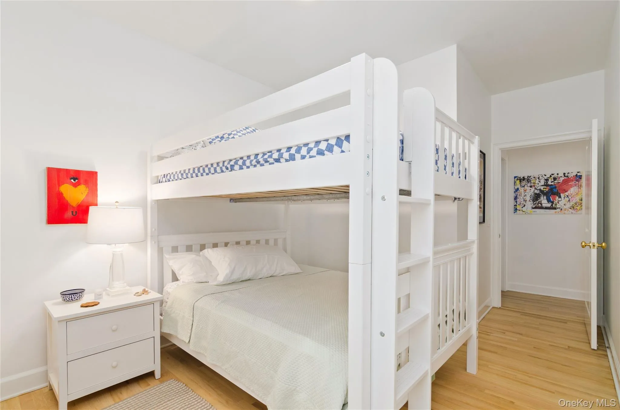 Bedroom with light wood finished floors Bedroom with light wood finished floors