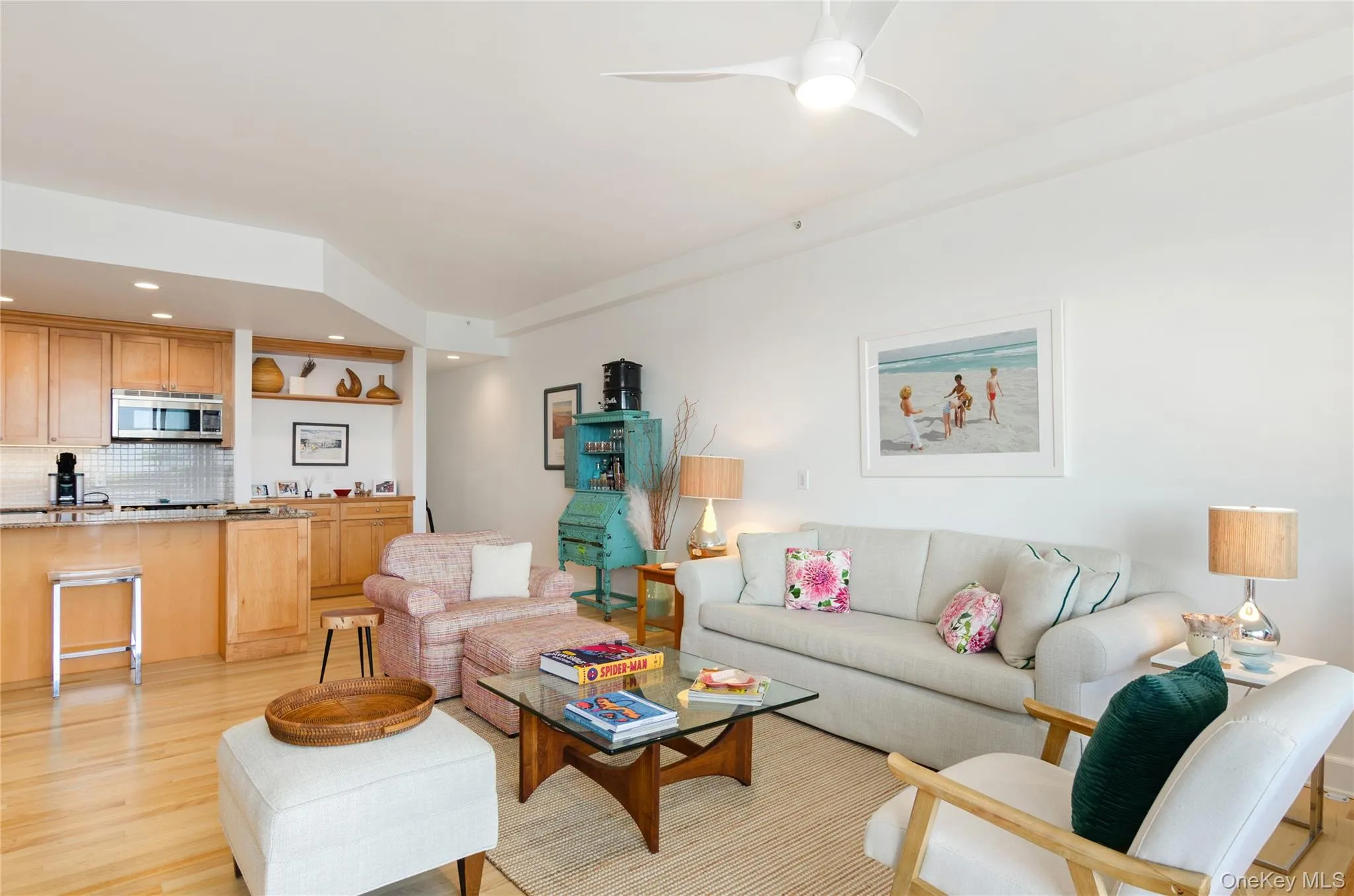 Living room featuring light wood finished floors, recessed lighting, and a ceiling fan Living room featuring light wood finished floors, recessed lighting, and a ceiling fan