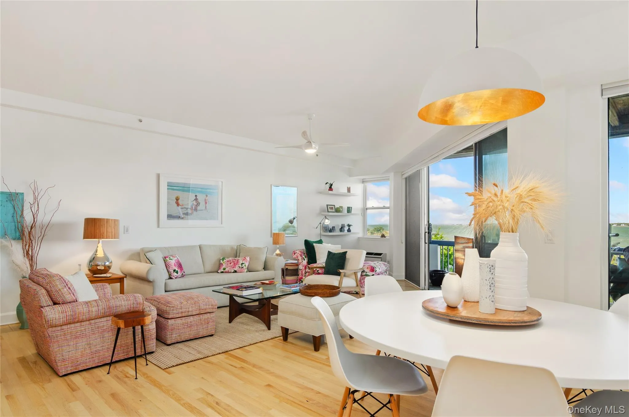 Dining area with light wood-style flooring and ceiling fan Dining area with light wood-style flooring and ceiling fan
