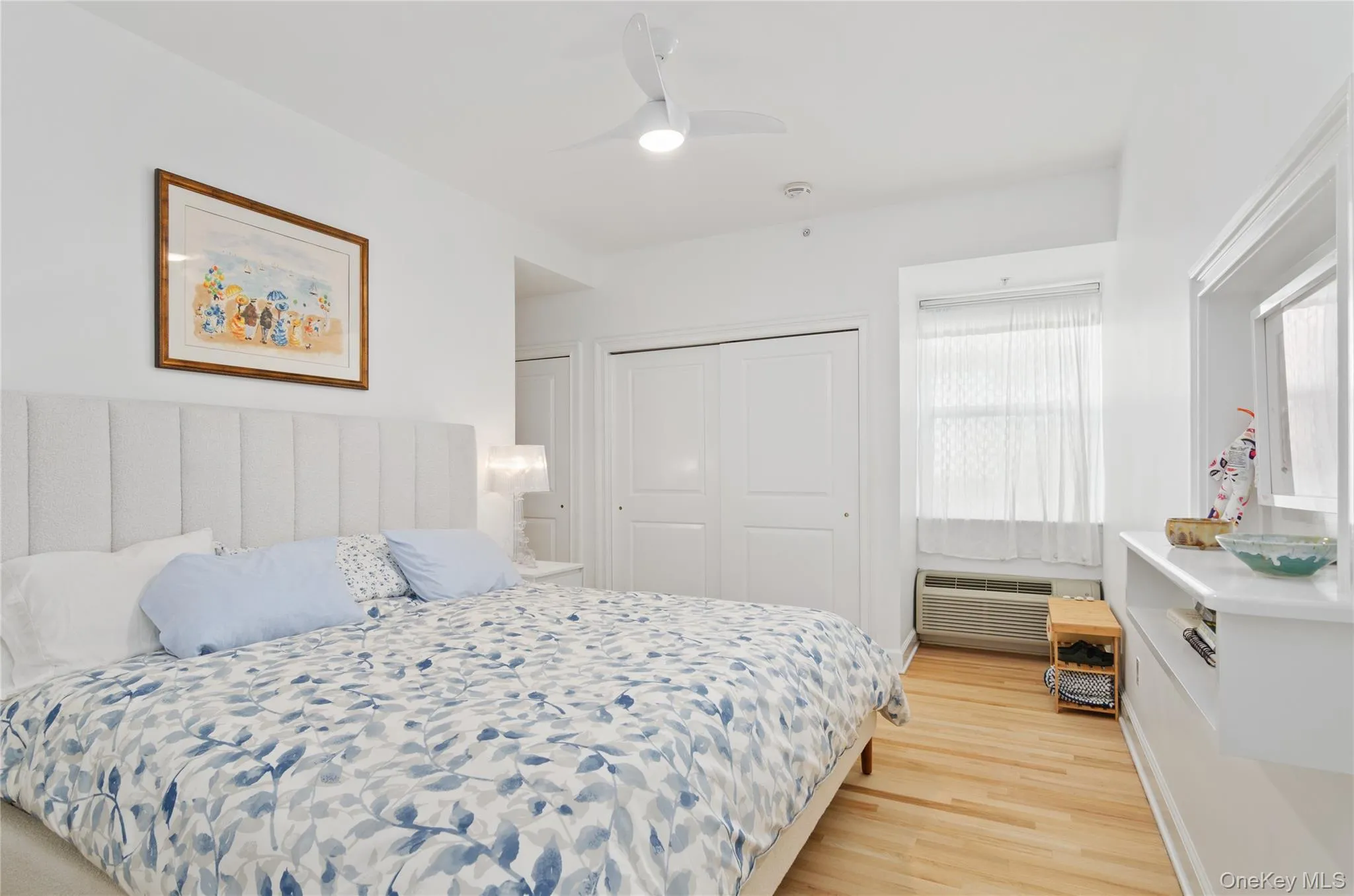 Bedroom featuring light wood-type flooring, a closet, and ceiling fan Bedroom featuring light wood-type flooring, a closet, and ceiling fan