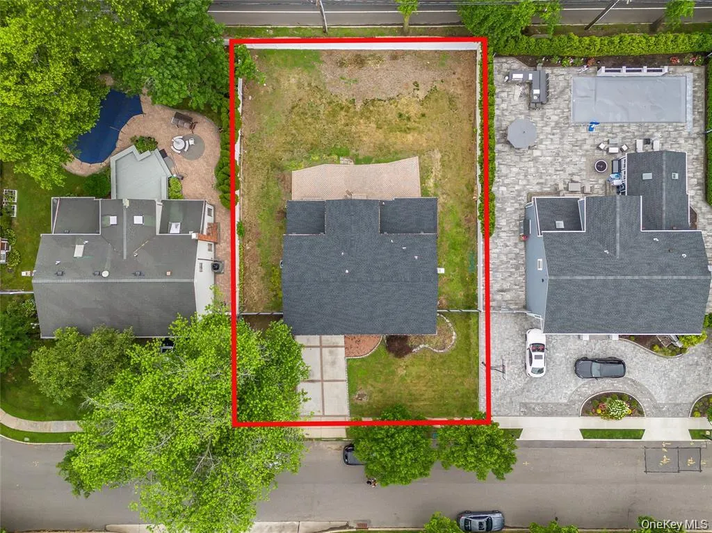 Aerial view of property and surrounding area with property boundaries highlighted Aerial view of property and surrounding area with property boundaries highlighted