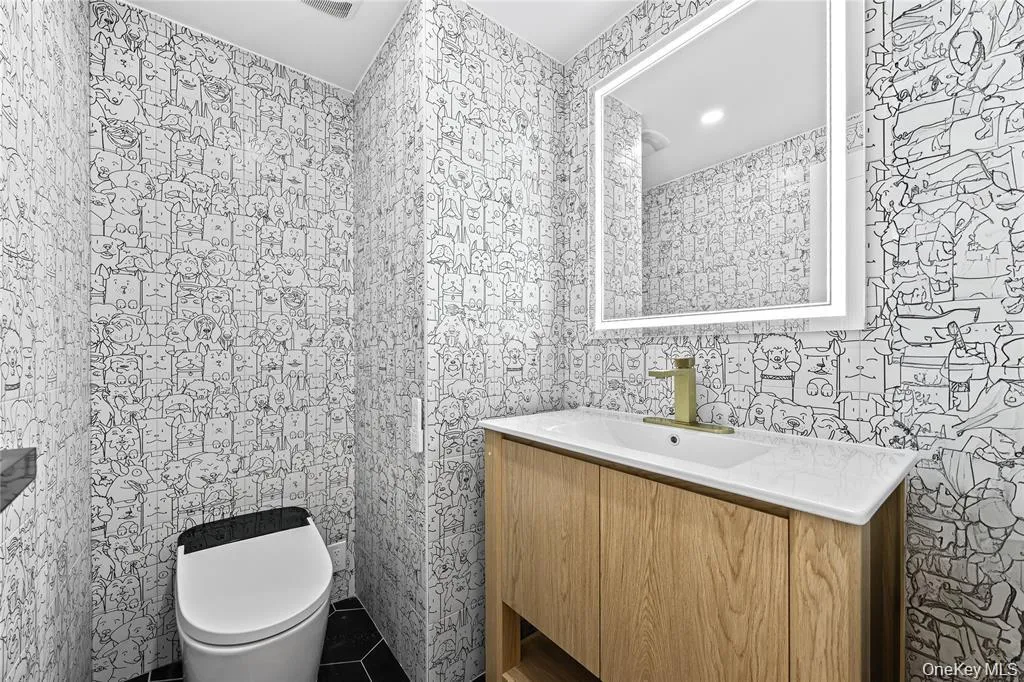 Bathroom featuring vanity, tile patterned floors, and recessed lighting Bathroom featuring vanity, tile patterned floors, and recessed lighting
