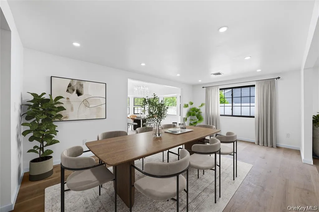 Dining room featuring wood finished floors and recessed lighting Dining room featuring wood finished floors and recessed lighting