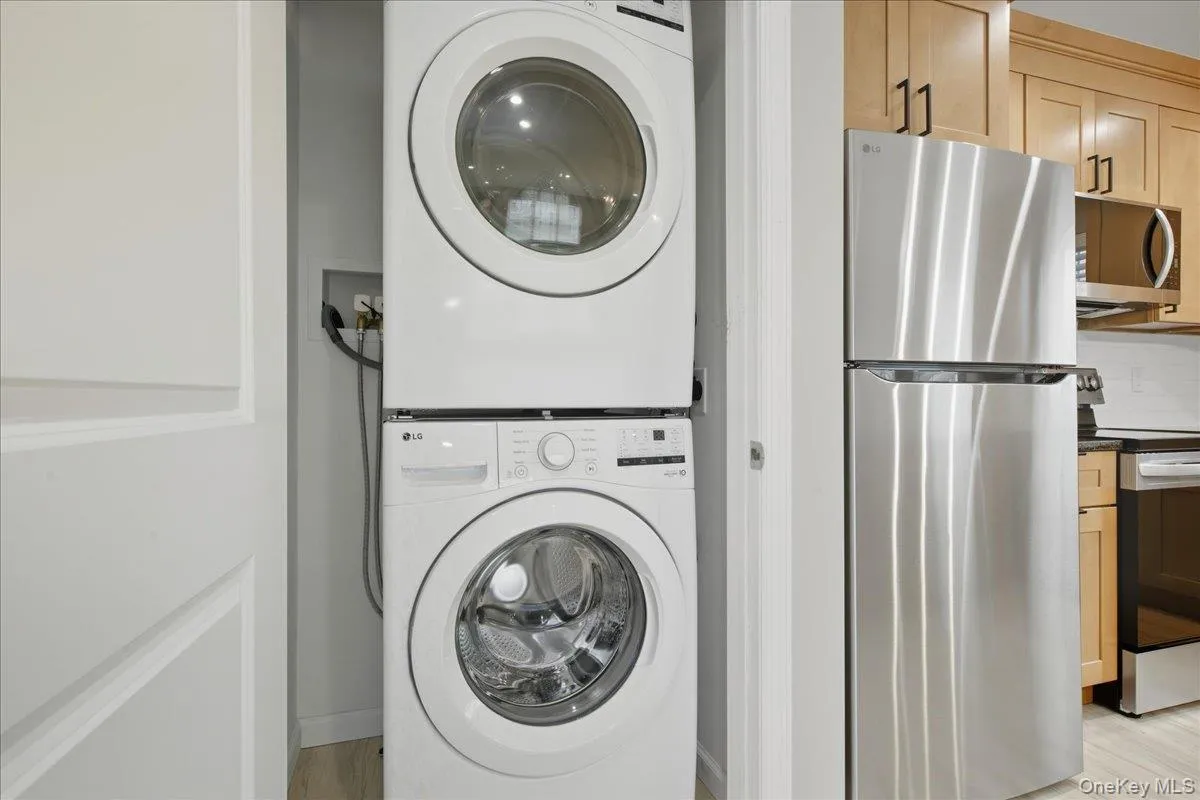 Laundry area Featuring Stacked Washer and Dryer Laundry area Featuring Stacked Washer and Dryer