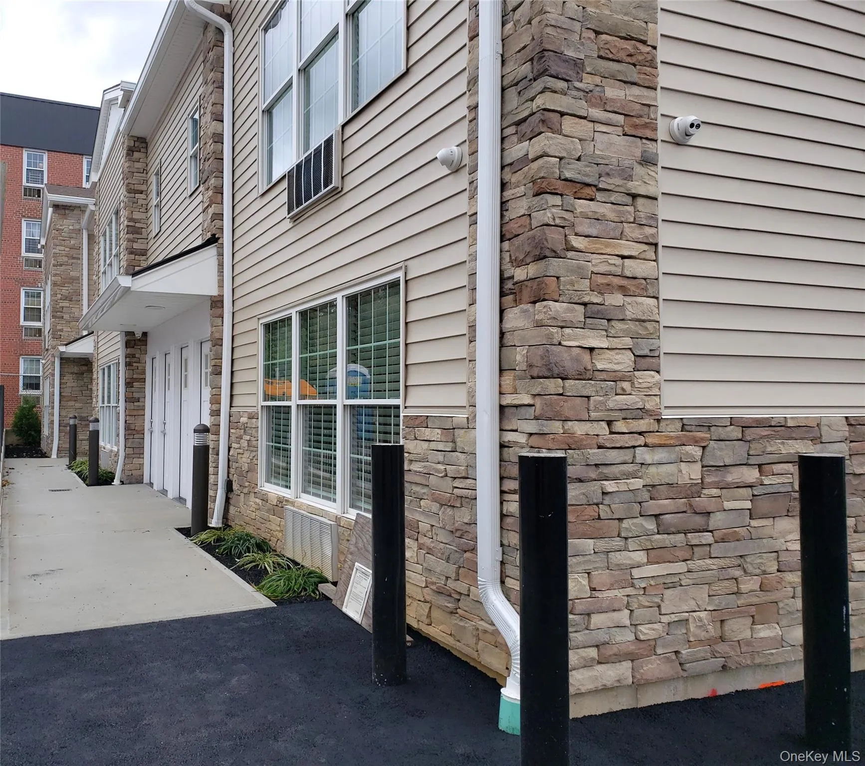 View of property exterior with stone siding View of property exterior with stone siding