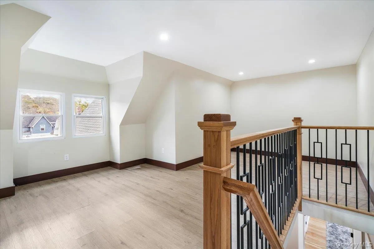 Bonus room featuring light wood-type flooring and recessed lighting Bonus room featuring light wood-type flooring and recessed lighting
