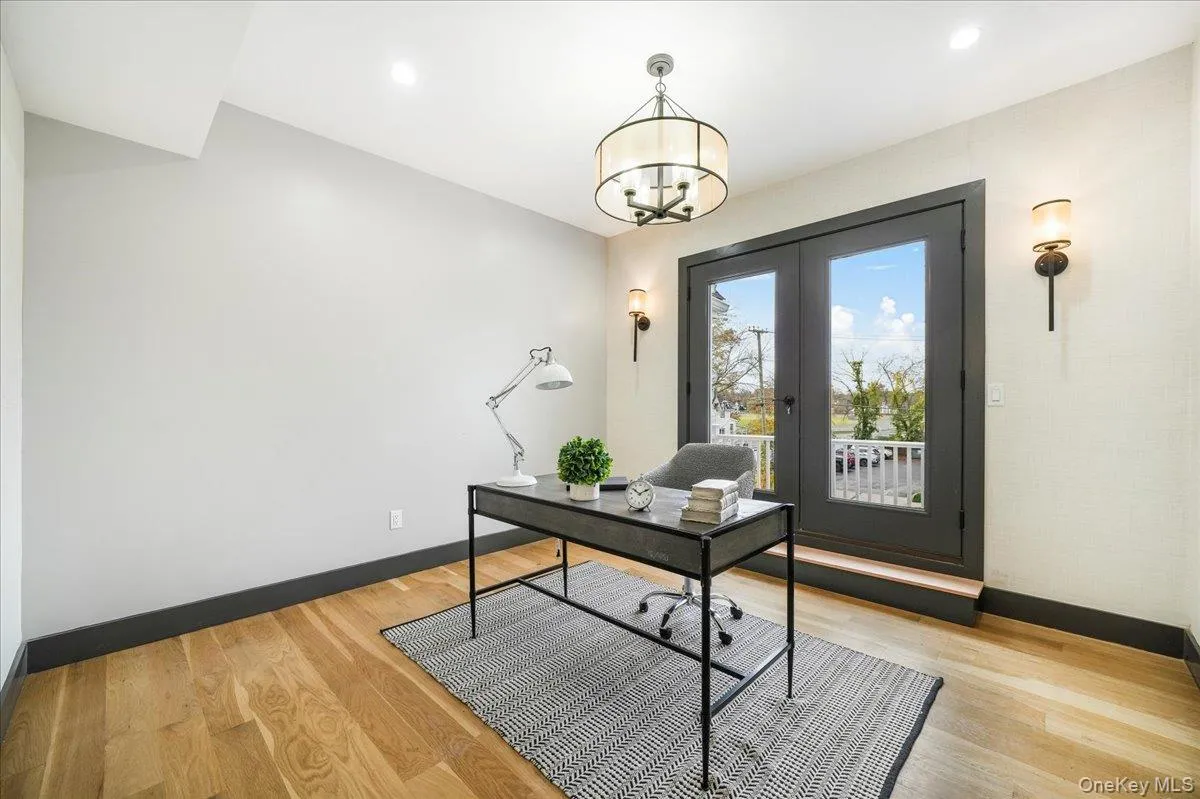 Office area featuring light wood-style floors, recessed lighting, and a chandelier Office area featuring light wood-style floors, recessed lighting, and a chandelier