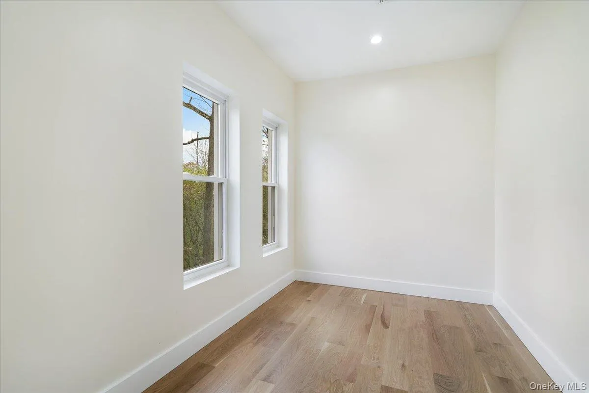 Empty room featuring light wood-style floors and recessed lighting Empty room featuring light wood-style floors and recessed lighting