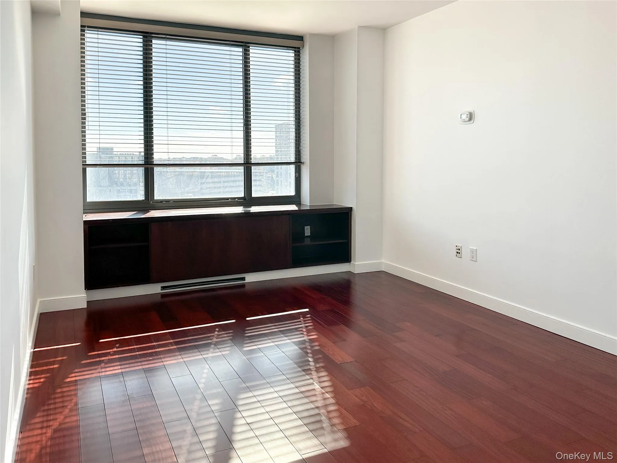 2nd bedroom with dark wood-style floors and picturesque view 2nd bedroom with dark wood-style floors and picturesque view