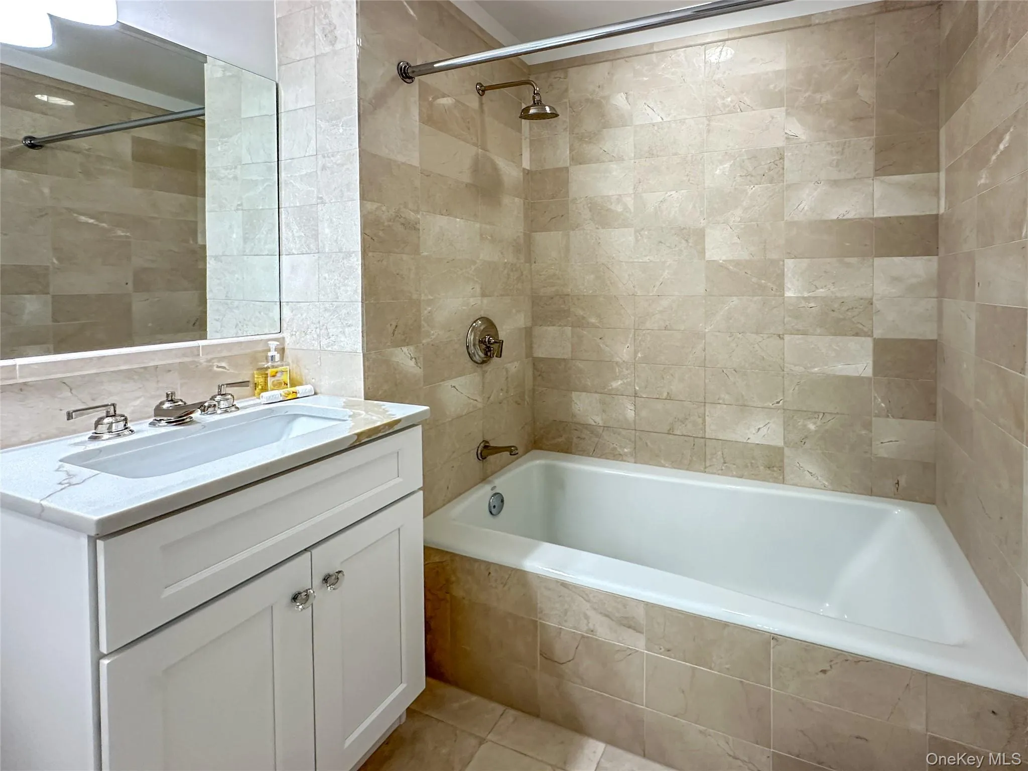 2nd bathroom with a shower / tub, brand new vanity and quartz top, and tile walls 2nd bathroom with a shower / tub, brand new vanity and quartz top, and tile walls