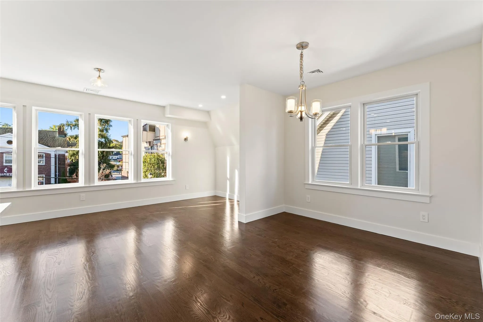 Living room and dining room with healthy amount of natural light Living room and dining room with healthy amount of natural light