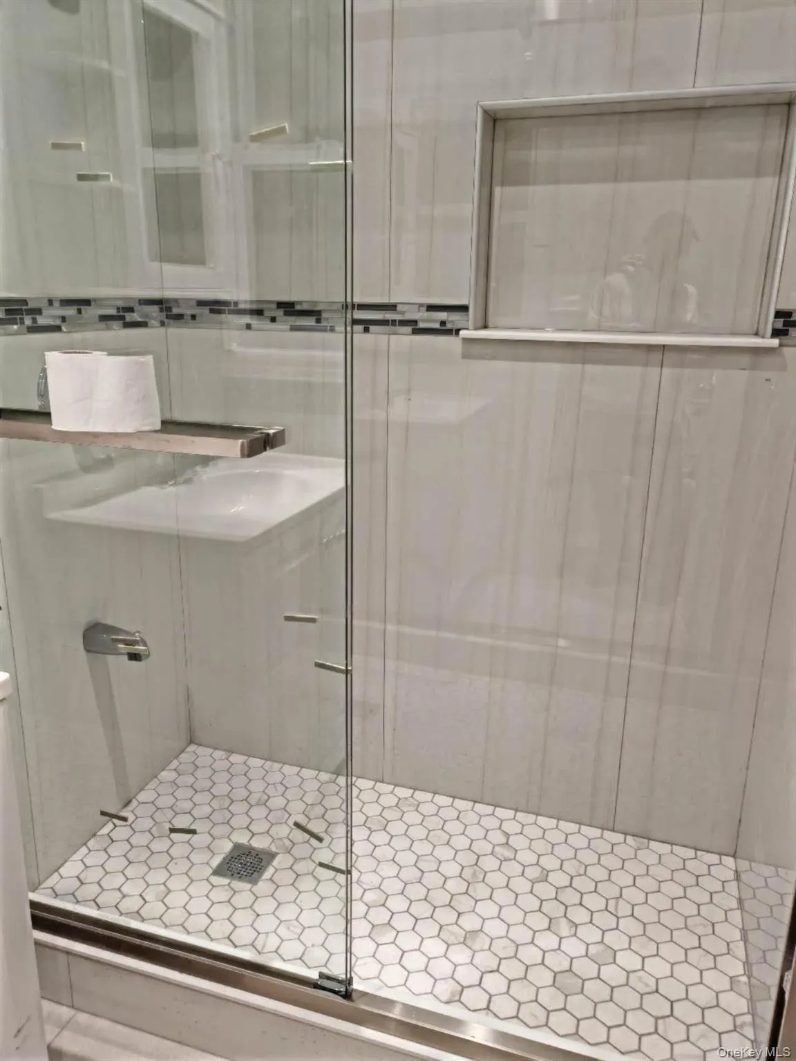 Full bathroom featuring a stall shower Full bathroom featuring a stall shower
