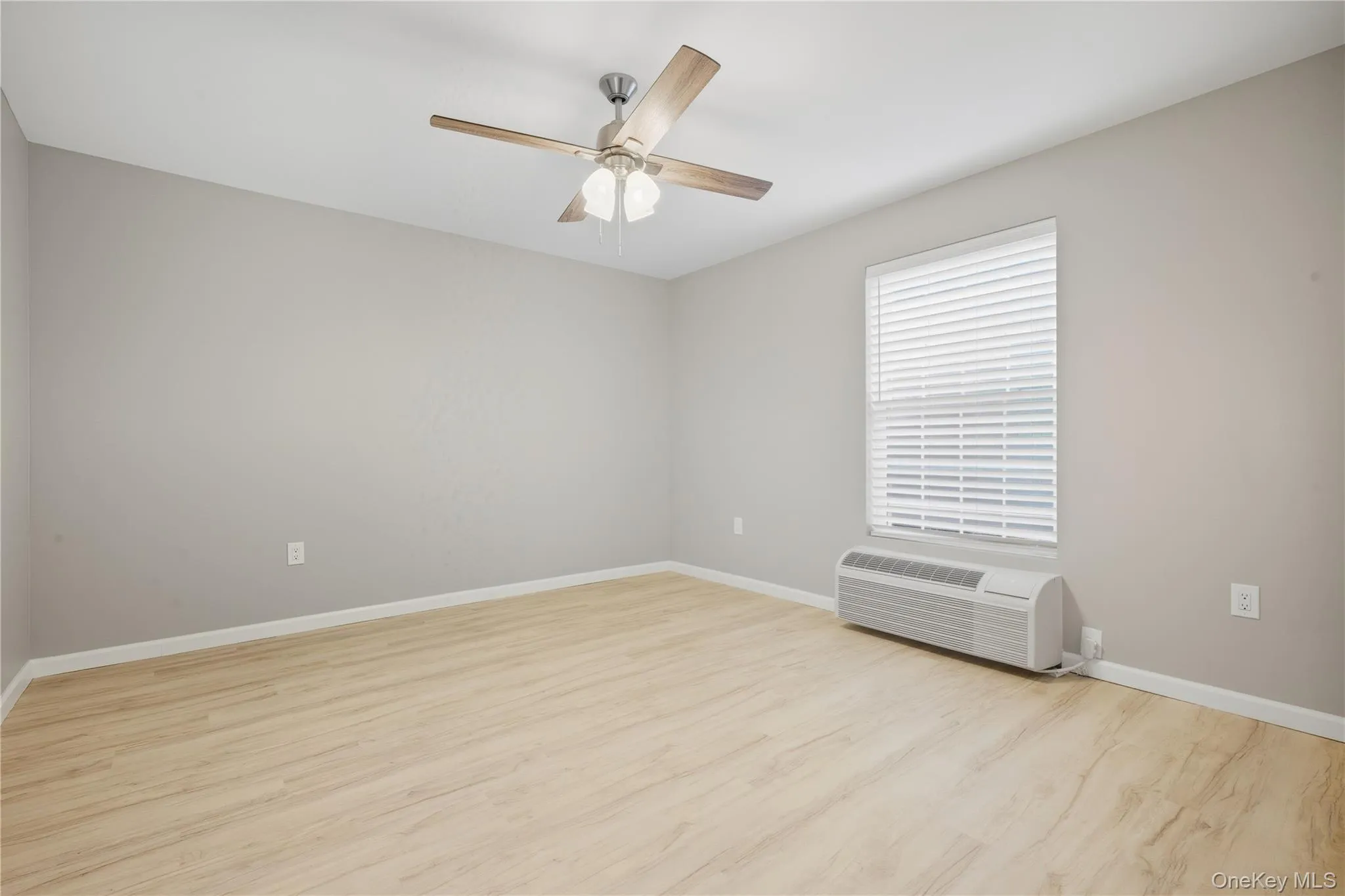 Bedroom Featuring Luxury Vinyl Flooring, Ductless AC/Heating Unit, Ceiling Fan Bedroom Featuring Luxury Vinyl Flooring, Ductless AC/Heating Unit, Ceiling Fan