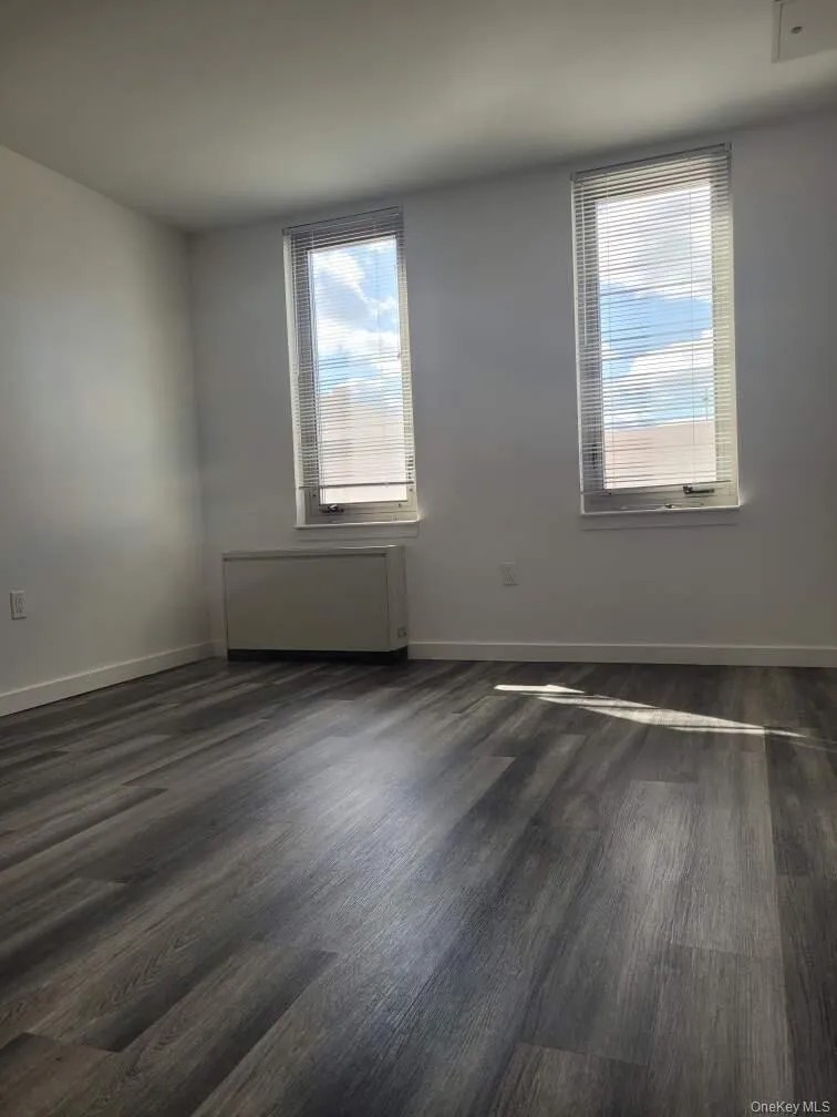Bedroom featuring dark wood-type flooring Bedroom featuring dark wood-type flooring