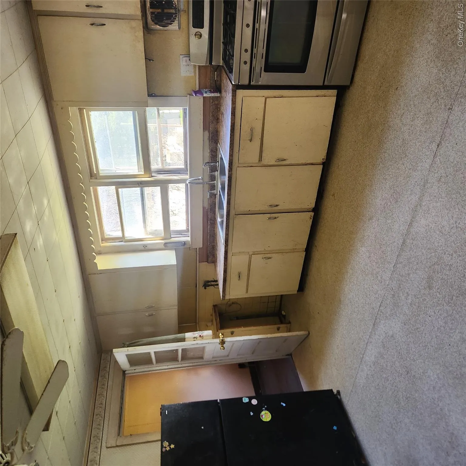Kitchen featuring range and refrigerator Kitchen featuring range and refrigerator