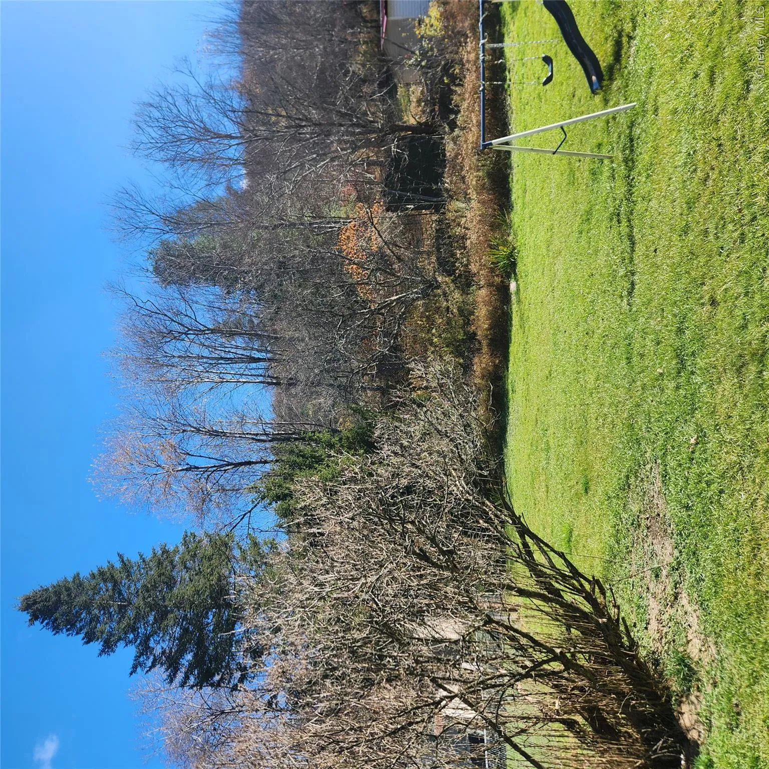 View of grassy yard featuring a playground View of grassy yard featuring a playground